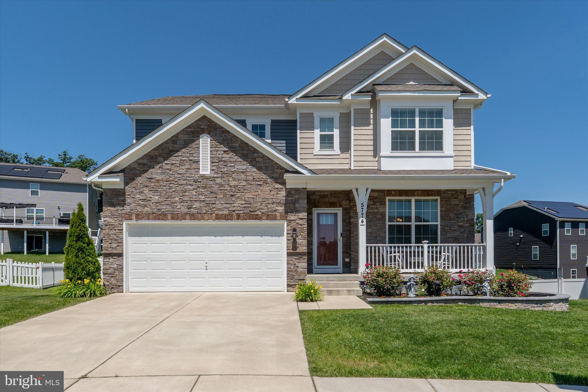 Located in the highly sought-after Preserve at Long Branch and Oakdale School, this exceptional home offers approximately 3,870 finished square feet of beautifully designed living space and features a rare four-season sunroom addition that truly sets this home apart.   With its soaring ceiling, elegant marble flooring, and walls of windows that flood the space with natural light, this stunning retreat can be enjoyed year-round.  ***
From the moment you arrive, the attractive decorative retaining wall, thoughtfully landscaped front yard, and welcoming covered front porch create outstanding curb appeal and a warm sense of home.  ***
Step inside to discover a spacious and inviting floor plan designed for both everyday living and effortless entertaining.  The formal dining room flows seamlessly into the expansive open-concept living area, highlighted by a beautifully appointed kitchen featuring quartz countertops, a large center island, abundant cabinetry, and an oversized walk-in pantry.  The kitchen opens to both the family room and casual dining area, creating the perfect gathering space for family and friends.  Just beyond, the remarkable four-season room offers direct access to the deck and provides a peaceful setting to enjoy morning coffee, evening relaxation, or year-round views of the backyard.  ***
A main-level bedroom and full bath provide exceptional flexibility, making an ideal guest suite, private home office, multi-generational living space, or convenient option for those seeking main-level accommodations.  ***
Upstairs, a spacious loft offers additional living space perfect for a media room, play area, home office, or lounge. Three generously sized bedrooms and two full baths complete the upper level, to include the luxurious primary suite. This private retreat features a sitting area, an enormous walk-in closet, and a spa-inspired en-suite bath with a soaking tub, separate shower, private water closet, and ample space to unwind.  ***
The finished walkout lower level expands the home's living space with an oversized recreation room that opens directly onto a beautiful stamped concrete patio, creating a wonderful indoor-outdoor entertaining experience. An unfinished room with plumbing rough-in provides the opportunity to create a fifth bedroom with an en-suite bath, making it ideal for guests, teens, or future expansion. Abundant storage space is also available on this level.  ***
Outside, the large, mostly level backyard is fully enclosed with privacy fencing and offers endless possibilities for gardening, play, pets, and outdoor enjoyment. Whether you're hosting gatherings on the composite deck with solar post caps, grilling with friends, or relaxing beneath the shade on the stamped concrete patio below, this outdoor living space is designed to be enjoyed throughout the seasons.  ***
This is truly a rare opportunity to own one of the most distinctive homes in the community. The exceptional four-season room, privacy-fenced backyard, composite deck, and shaded stamped concrete patio create a combination that is seldom available. All of this is located within a desirable neighborhood featuring walking and jogging trails, playgrounds, tot lots, and convenient access to top-rated schools, shopping, dining, and commuter routes.  ***
A must-see property that perfectly combines space, comfort, functionality, and outdoor living.