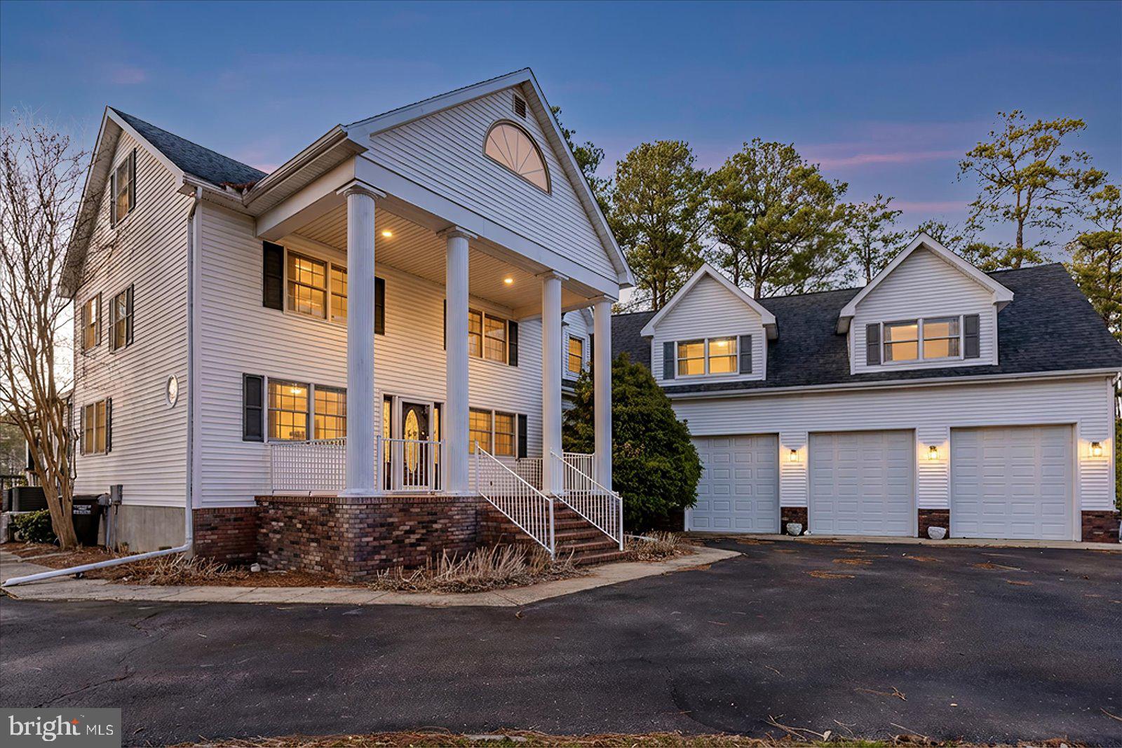 Stunning waterfront estate offering 6 bedrooms and 4.5 baths across three beautifully designed levels. Expanded in 2008, this exceptional home features 5,615 square feet of thoughtfully crafted living space, perfect for entertaining and everyday luxury. Enjoy seamless indoor-outdoor living with expansive water views, a private dock and a boat lift for effortless coastal access. Unwind in the hot tub after a day on the water or at the nearby beach. Additional highlights include a spacious three-car garage, generous living areas, and timeless architectural detail throughout. A rare opportunity to own a premier waterfront retreat just minutes from the beach.