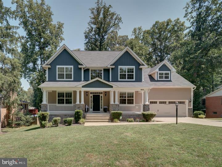 NO HOA - Craftsman-style single-family home in Triangle, VA, featuring a total of 5 bedrooms and 3.5 baths. As you approach the house, you are greeted by a welcoming front porch adorned with classic Craftsman columns, perfect for enjoying a morning coffee or evening relaxation. Step inside to a welcoming foyer that leads you to a bright and airy living room/office with large windows, providing a versatile space for work or relaxation. The formal dining room is perfect for hosting dinner parties and holiday celebrations. The family room, open to the kitchen, boasts a cozy fireplace, making it an ideal spot for family gatherings. The kitchen is equipped with stainless steel appliances, granite countertops, a good-sized island, and plenty of cabinet space for all your culinary needs. The owner's suite offers vaulted ceilings, a walk-in closet, and an en-suite bathroom featuring a double vanity, soaking tub, and a separate shower. Three additional bedrooms on the upper level each have large windows that allow plenty of natural light and spacious closets. The walk-out basement provides a large bedroom with a window for natural light, wet bar, perfect for guests, along with a full bathroom and a spacious recreational area, offering endless possibilities for entertainment or additional living space. Additional features include a long driveway providing plenty of parking, and the home is situated in a quiet and family-friendly neighborhood in Triangle, VA, with easy access to local schools, parks, shopping, and dining. This house is an ideal choice for families seeking a comfortable and stylish living environment.