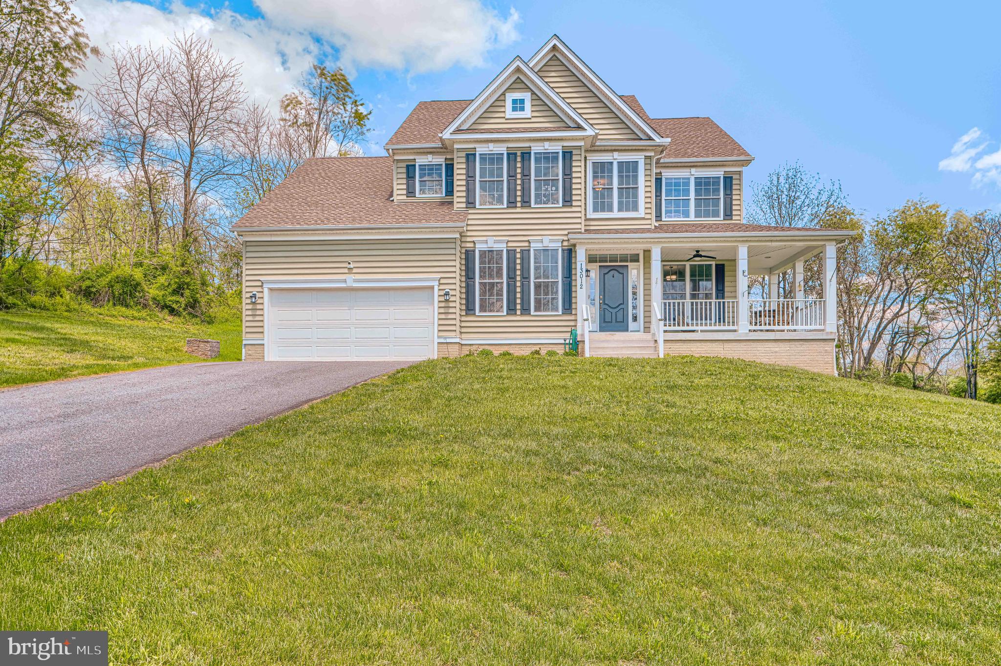 Welcome to this beautifully upgraded custom colonial! Filled with natural light and thoughtfully designed living spaces, this home offers the perfect blend of elegance, comfort, and functionality. The inviting front porch leads into an open-concept layout featuring a private home office, formal dining area with tray ceilings, and spacious living areas ideal for entertaining. The gourmet kitchen is a standout with 42” white shaker cabinetry, granite countertops, stainless steel appliances, a large center island, and sunny breakfast area overlooking the backyard. The dramatic family room features soaring cathedral ceilings and a stunning stone fireplace. Upstairs, the luxurious owner’s suite offers a spacious walk-in closet, spa-inspired bath with designer tile finishes. Three additional generously sized bedrooms, and full bath complete the upper level. The walk-out basement is partially finished and has bathroom rough-ins, providing endless possibilities for future expansion and added value. Situated on a peaceful private lot, this move-in ready home offers the space, upgrades, and layout today’s buyers are searching for!