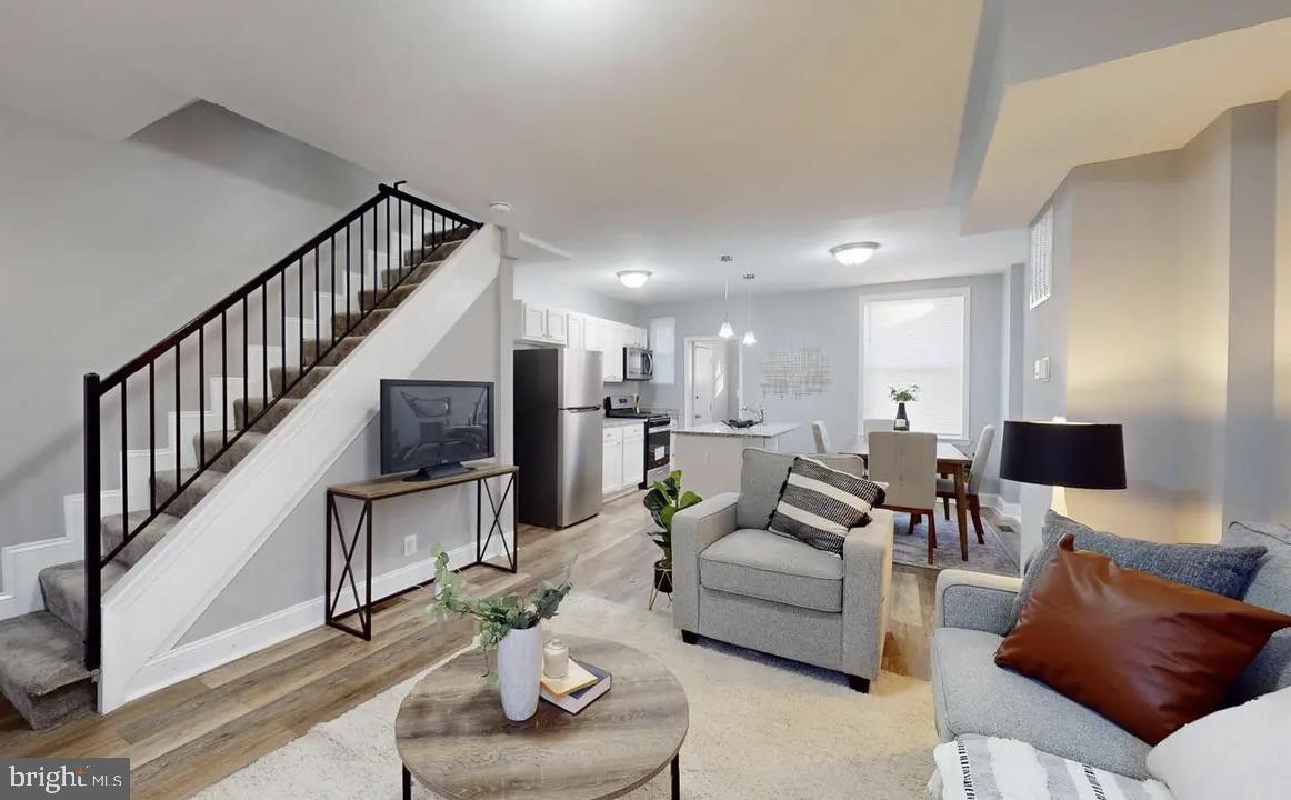 A Stunning Gem in the Four By Four Neighborhood!

Step inside this beautifully renovated townhome and fall in love with its modern upgrades and timeless charm. This 2-bedroom, 1-bath home features a brand-new kitchen with granite countertops, stylish cabinetry, and stainless steel appliances — perfect for anyone who loves to cook and entertain.
Enjoy sun-drenched rooms filled with natural light, new luxury vinyl plank flooring throughout, and fresh designer paint that gives the home a warm and welcoming feel. Relax on the covered front porch or host summer gatherings on the brand-new rear deck — ideal for outdoor living and entertaining. The unfinished basement offers great potential — whether you use it for extra storage or finish it to add even more living space, the choice is yours! Located just blocks from multiple parks, and only minutes from downtown Baltimore, this home blends comfort, convenience, and community living in one unbeatable package.

This property is a short sale