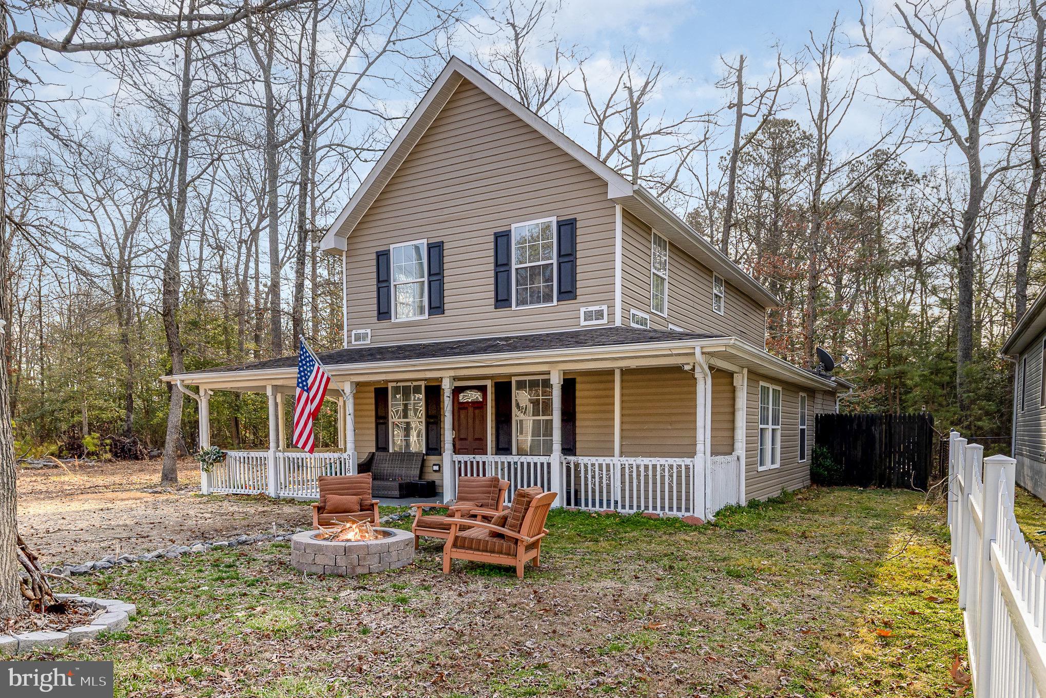Welcome home to this charming  home in Colonial Beach! Just a little more than 3 blocks to Beach Ave and ocean front! Enjoy small town living near the water! The main level was renovated in August 2023 with fresh paint, new LVP flooring, and new kitchen appliances. This home boasts 3 bedrooms and 2 full bathrooms with a primary suite on each level! Upper level laundry room makes washing, drying, folding and putting away a breeze! The open concept spaces are full of natural light pouring in from the many large windows. The exterior is just as welcoming as the indoor spaces! The welcoming partial wrap around porch is perfect for your morning coffee or afternoon tea or cocktails! The spacious front and back yards allow for great relaxation and socializing. Enjoy summer barbecues and cozy spring and fall evenings on the brand new deck (July 2024.) New washer & dryer (2024.)