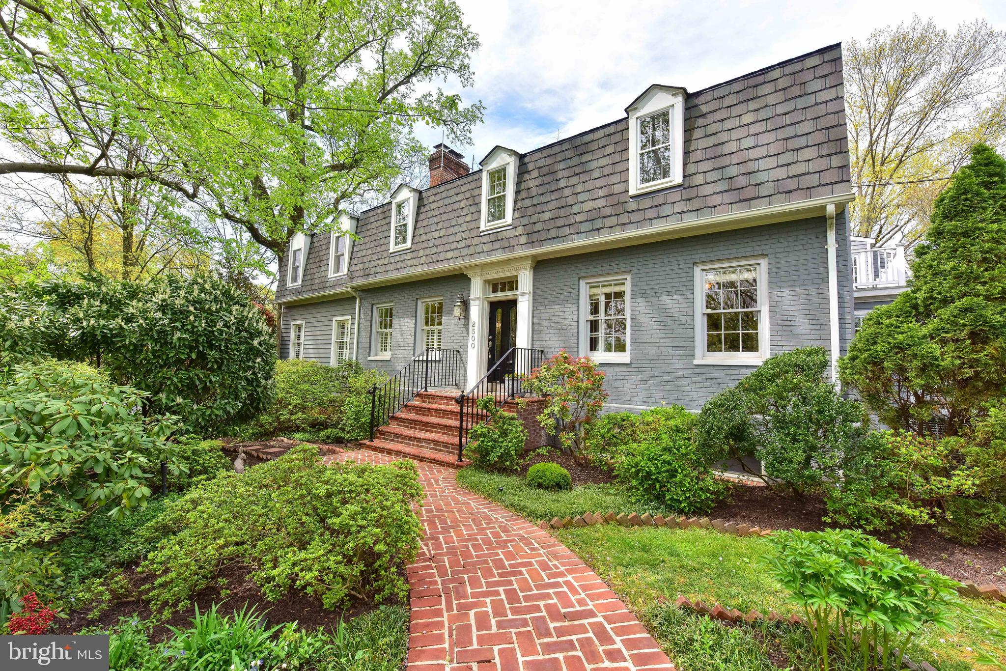 Nestled on a quiet, corner lot in the rolling hills of North Arlington's Woodmont neighborhood, this 1940 Colonial exemplifies the best melding of vintage details with modern upgrades.  Featuring 5 large upper-level bedrooms this house has undergone significant improvements with amenities including a 2-car garage, a guest/nanny/in-law suite, and a roof deck overlooking Fort C.F Smith Park.  A white picket front fence and fully enclosed back yard compliment the mature landscaping.  Interior features include a mudroom entry, 2 wood-burning fireplaces, a free standing soaking tub in the spa like master bath and a sauna.  The gourmet kitchen with double ovens and quartz countertops overlooks the lush parkland. Located within minutes of the George Washington Parkway and Route 66, the location provides convenient access to Washington D.C., Tyson's Corner, Crystal City and Reagan Washington National Airport.  A truly special property and a rare opportunity to live in a serene location just moments from the Nation's Capital.