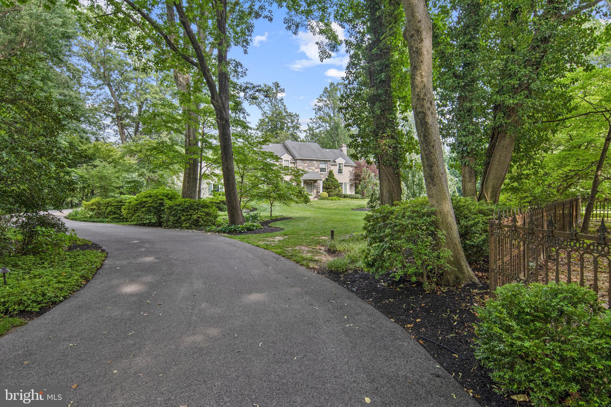 Welcome to 8 Shannon Circle located within the coveted Radnor Township and award winning Radnor School District, exceptionally situated on a quiet yet convenient cul-de-sac in the community. Hallmarks of this fine home include: Captivating and alluring curb appeal first noticed as you drive up the extended curved driveway. A myriad of meticulously maintained mature perennial gardens and specimen plantings. Inviting walkways, an un-compromised private 1 acre irrigated grassy homesite with grand scale outdoor entertaining spaces offering a truly peaceful retreat.  The interior is equally remarkable from the welcoming entry foyer with gracious turned staircase, extended fireside living room and noteworthy cozy private study with built-in desk, bar and access to bluestone terrace. Love entertaining look no further, savor the holidays in the formal dining room leading to the updated Chef's kitchen and bright bay window breakfast room full of high end furniture quality inset cabinetry and appliances including Sub-Zero (fridge with additional built in hidden freezer drawers), wine chiller, Wolf double ovens and new center island cooktop, practical wall of pantry cabinetry, convenient appliance garage  and  direct access to patio offering a seasonal al fresco dining option are a just few highlights of this entertaining work space. Off the center hall and kitchen is a very comfortable family room with raised hearth brick fireplace and doors to the bluestone patio with views of the lush landscape and yard. A main floor powder room and 2 car attached garage complete the living level of the home. Upstairs you will find an updated primary suite to include a dressing area with a built-in floor to ceiling furniture style dresser, custom outfitted walk-in closet, upgraded primary bath with soaking tub, glassed shower, dual vanity sink with inset cabinetry, storage tower and natural stone tops. There are 3 additional generous sized bedrooms all with really nice closet space and serviced by an updated dual vanity hall bath. The conveniently located upper hall laundry completes the second floor. The finished lower level offers endless possibilities and includes a great room, an additional room that could be exercise, guest room or au-pair suite and includes a full bath with a stall shower nearby. Unbeatable location conveniently located within close proximity to downtown Bryn Mawr, Wayne, Suburban Sq. and all the Main Line dining and entertaining destinations. Enjoy regional rail lines and close proximity to CC, sports parks and the airport. Opportunity is knocking as this offering is available to just 1 lucky home buyer!