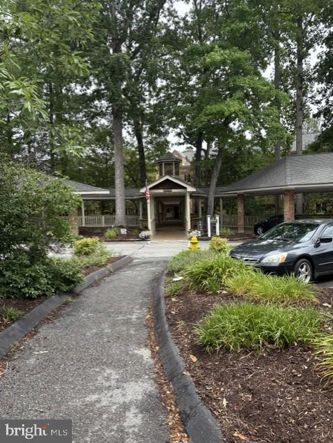 Beautiful 2 bedroom 2 bathroom condo in the sought after Wildewood Retirement Village.  This unit has been totally remodeled.  Upgraded flooring throughout.   Granite countertops, stainless appliances, bar style seating and separate dining area.  Open concept living room with site lines to all main living areas. Spacious primary bedroom and primary bathroom with dual sinks and walk in shower.  Additional bedroom and full bathroom located in hallway.  Stacked washer/dryer in unit.  Elevator access and unit is located just a few doors down.  Condo fee includes basic cable, water, sewer and trash.  Condo also covers all exterior maintenance, snow removal and grounds maintenance.   Close to shopping and area amenities.  Community activities are published on a monthly basis.  Move in, sit back, relax and enjoy retirement living at its best.  Schedule your online appointment today.