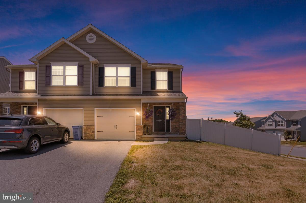 Join us for an Open House on June 16th from 5:30 to 7 p.m!

Nestled on a quiet corner at Fairmont and Mt Vernon, this 2019 semi‑detached home offers a polished blend of comfort and modern design. Thoughtfully maintained by its second owner, the property welcomes you with an airy, open main level that feels bright and effortless from the moment you step inside. The kitchen and living area flow together seamlessly, creating an inviting space for both everyday living and entertaining. A first‑floor half bath adds convenience, while the rear deck—enhanced with added stairs—provides easy access to the outdoor space.

The fully fenced yard with privacy fencing offers a serene setting for relaxing, hosting, or enjoying time outdoors. Upstairs, the primary suite features a walk‑in closet and private bath, complemented by two additional bedrooms and a second full bath.

The walkout lower level is a standout feature, offering high ceilings and full glass doors that open directly to the backyard. The space is ready for your vision, whether you imagine a stylish lounge, home gym, or additional living area.

Altogether, this home offers a well‑balanced blend of comfort and thoughtful design in a quiet corner‑lot setting. Schedule your showing—this one will not last long.