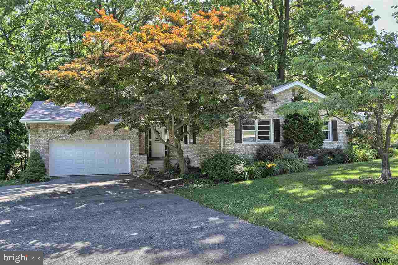 Stunning luxury rancher w/brand new upgrades! Gleaming wood floors throughout. Modern mocha cabinetry w/Carrera Marble tops. Truly open flowing floor plan. Luxury master bath w/modern touches! Huge finished basement w/8ft high ceilings & a bar! Park-like corner lot w/easy access to all! One of a kind find!