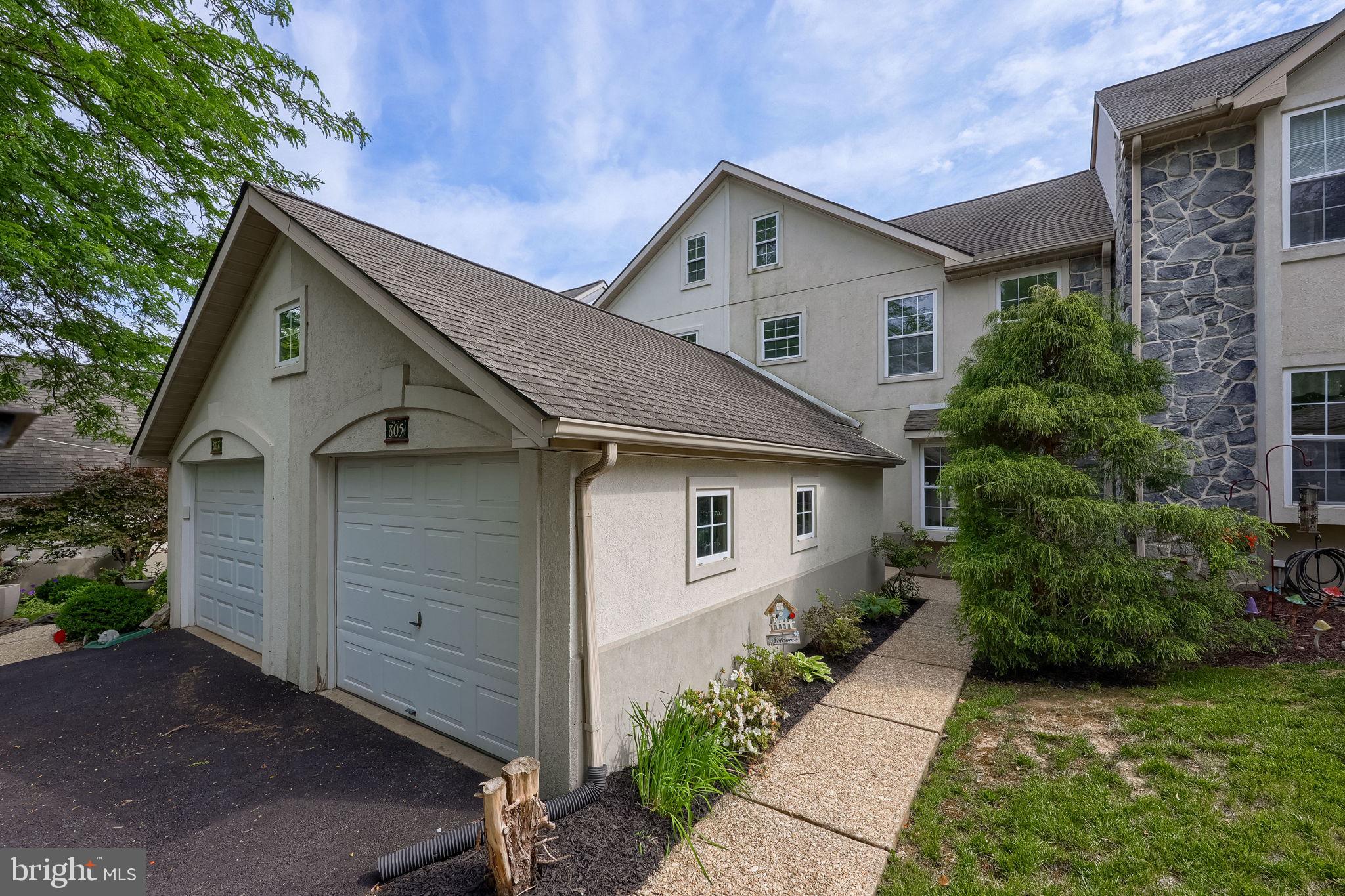 Welcome to low-maintenance living in the desirable Crossgates Community in Millersville, Pennsylvania, where turnkey exterior maintenance including mowing and snow removal is fully handled for you. Situated just minutes from Millersville University, shopping, restaurants, and more, this beautiful townhome offers a bright two-story foyer with brand-new plank flooring that flows seamlessly throughout the first floor. The spacious kitchen features stainless steel appliances, large windows that flood the space with natural light, and room for a dining table, while the main living room offers plenty of space and opens through a patio door onto a covered deck overlooking a quiet, tree-lined backyard. A half bath, abundant closet space, and access to the one-car garage complete the main level. Upstairs, two generously sized bedrooms feature brand-new carpeting and share a full main bathroom, and the primary bedroom includes a walk-in closet with built-in laundry units, adding the convenience of keeping your laundry on the upper level. The finished walkout daylight basement offers incredible flexibility, easily serving as in-law quarters for extended family or guests, as it features a large living area, a second kitchen, and an additional full bath with a spacious shower, along with a mechanical room offering extra storage and another finished storage closet. A brick paver patio off this level is perfect for outdoor enjoyment, making this home a perfect blend of comfort, privacy, and carefree living.