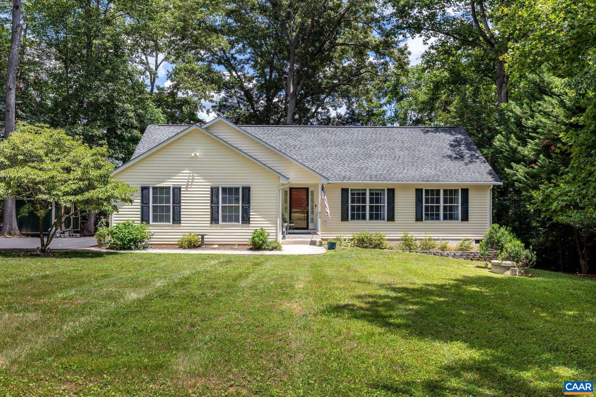 Welcome home to 211 Spring Haven Lane in Ruckersville! This beautifully updated and meticulously maintained ranch offers sought-after one-level living on a spacious and level 0.72-acre lot. Surrounded by mature trees and peaceful views, this move-in-ready home combines modern upgrades with everyday comfort. Inside, you'll find hardwood flooring throughout the main living areas, luxury vinyl tile flooring in both bathrooms, and a bright, welcoming floor plan designed for easy living. The updated kitchen features quartz countertops and stainless appliances (2021), creating a stylish and functional space for cooking and entertaining. Major improvements provide peace of mind, including a new HVAC system (2024), paved driveway (2023), leaf guards (2022), and semi-annual pest control service. Step outside to enjoy the screened rear deck, the perfect spot for morning coffee, outdoor dining, or relaxing while overlooking the private wooded backdrop. Offering 3 bedrooms, 2 full bathrooms, an attached garage, and a large level yard with plenty of room for gardening, play, or pets, this property is ideal for those seeking a low-maintenance home in a convenient location. Just minutes from Rt 29 yet tucked away. Check out the virtual tour!,Painted Cabinets,Quartz Counter