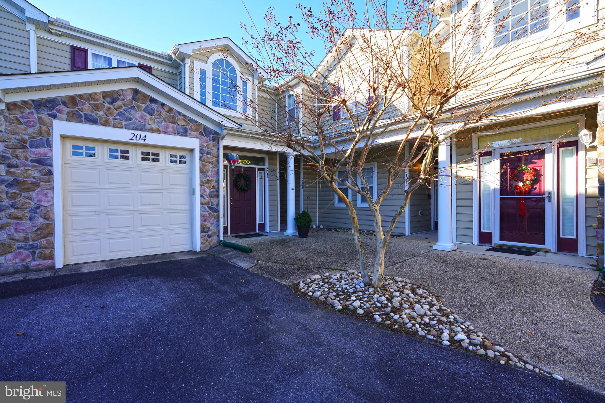 Back on the Market Due to No fault of the Seller or the Property. This is your second chance!  Welcome to 18881 Forgotten Harbor Court #204 in Woods Cove! This well-designed 3-bedroom, 2-bath condominium features vaulted ceilings, an open floor plan, and a desirable split bedroom layout that offers added privacy for owners and guests alike. The kitchen, dining, and living areas flow seamlessly, creating a bright and inviting main living space ideal for both everyday living and entertaining.  An L-shaped sunroom fills the common area with natural light and provides flexible additional living space—perfect for relaxing, reading, or enjoying morning coffee. The private primary suite includes an en suite bath and walk in closet, while two secondary bedrooms offer versatility for guests or a home office. A one-car garage adds convenience and extra storage.  Enjoy low-maintenance living in the sought-after Woods Cove community, close to shopping, dining, and area beaches.