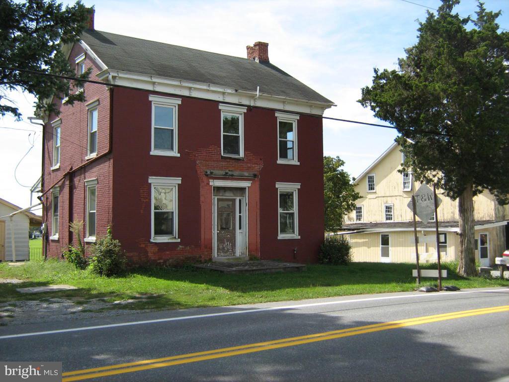 This recently sub-divided two acre farmette includes a circa 1860 farmhouse, large original bank barn and several outbuildings in various conditions.  The house has recent replacement windows.  Enjoy the verdant vista overlooking organic farmland from the large back porch.  This property is being offered AS IS. Bring your personal vision.