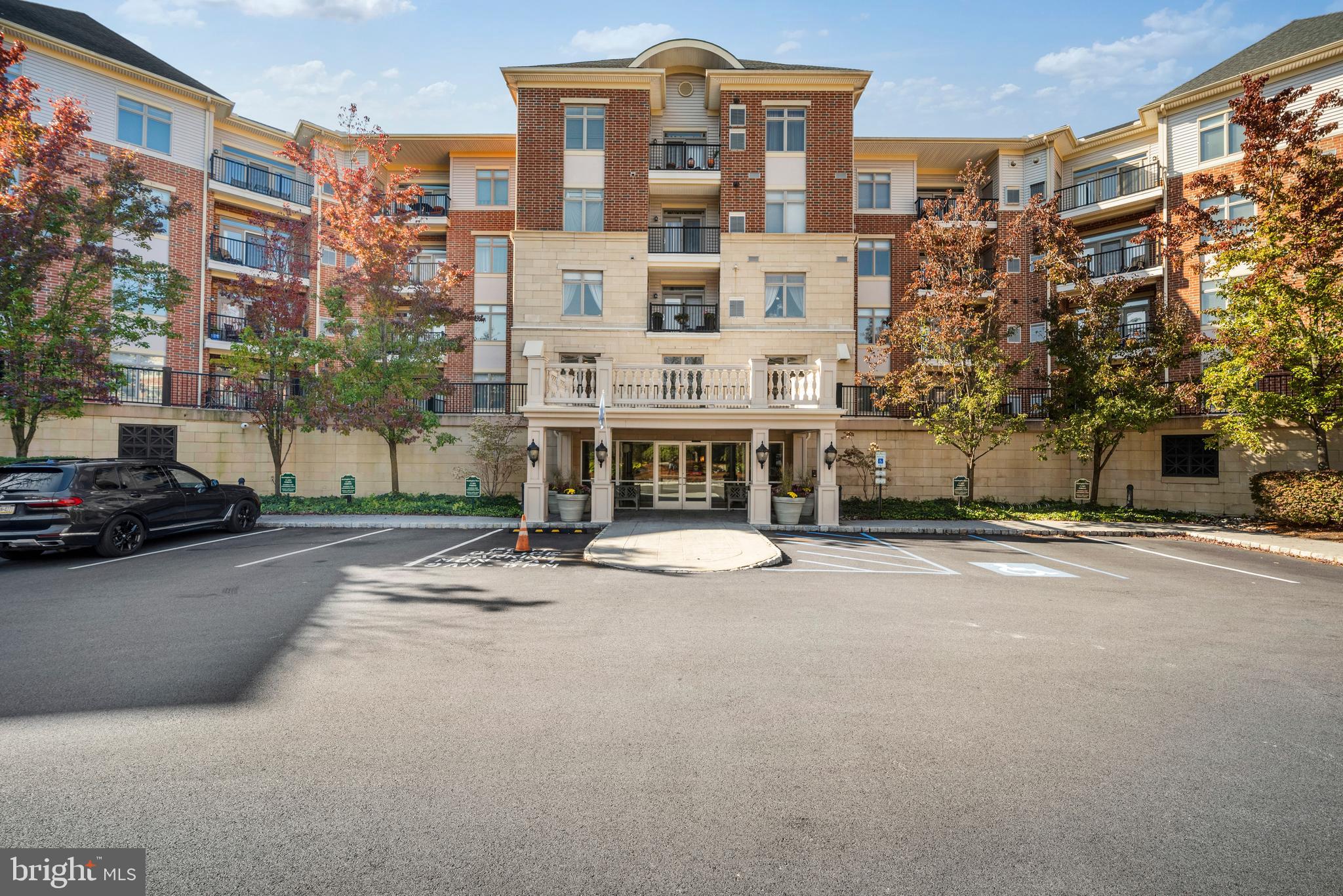 Welcome to this exceptional penthouse-style condominium offering the perfect blend of comfort, space, and breathtaking natural surroundings. This unique residence features two bedrooms and office on the main level plus a spacious loft that can easily serve as a third bedroom, second office, playroom, or flex space to fit your lifestyle. Step inside and be greeted by a welcoming foyer. To the left, you’ll find a convenient laundry room, while a private office is located to the right. Continue down the hallway and enter the heart of the home—a beautifully designed open-concept kitchen and living area. The kitchen is thoughtfully appointed with abundant cabinetry, including 40-inch upper cabinets that provide exceptional storage space. Granite countertops offer durability, easy maintenance, and timeless appeal, while the gas range is sure to impress anyone who enjoys cooking at home. The dramatic two-story ceiling in the living room creates an impressive sense of openness and natural light. Three large double windows overlook the pond and fill the space with sunshine throughout the day. Two separate sliding doors provide access to private balconies, allowing you to fully enjoy the spectacular setting. This is arguably one of the finest locations in the building. Every window frames peaceful views of nature, including mature trees, the tranquil pond, ducks, turtles, and other wildlife. In the mornings, you may even spot majestic bald eagles hunting over the water. Enjoy a serene environment with no traffic noise—just peace, privacy, and beautiful scenery. The primary suite is located on the left side of the living room and features a luxurious private bath with a double vanity, separate shower, and soaking tub, creating a spa-like retreat you’ll never want to leave. The second bedroom is situated on the opposite side of the living room and is served by a full hall bathroom. The loft overlooks the main living area, enhancing the home’s open and airy feel while offering additional versatile living space. Each bedroom enjoys access to its own private balcony. Residents enjoy an impressive array of amenities, including an indoor swimming pool, fitness center, secure mail room, and parking garage. This unit includes two dedicated garage parking spaces. A scenic walking path behind the building winds along the pond, providing the perfect place for daily walks and relaxation. Ample guest parking is available in the courtyard area. Ideally located near shopping, dining, and everyday conveniences, this home offers the tranquility of a natural setting while maintaining quick access to the city. Don’t miss this rare opportunity to own one of the most desirable residences in the community.