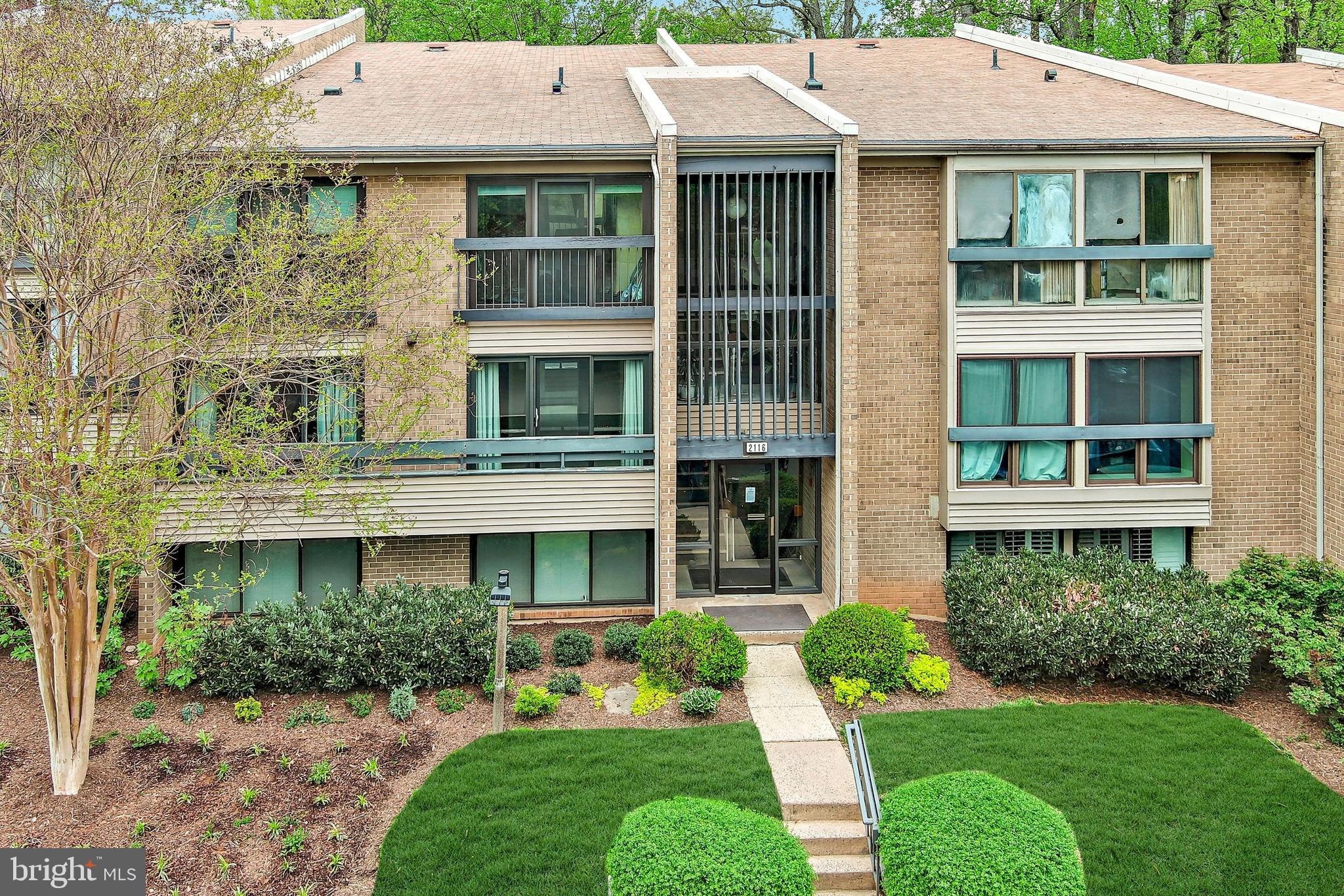 Welcome home to this immaculate, light-filled condo offering direct views of the Reston National Golf Course fairway, the 5th hole, and the scenic Reston Association walking trail. Perfectly positioned in the desirable Woodwind I community (FHA Approved), this beautifully updated residence offers soaring ceilings, an open, airy layout, and abundant natural light. Step inside to an inviting open-concept living and dining area—ideal for entertaining or relaxing while taking in the stunning golf course views. The spacious kitchen features marble countertops and  backsplash, and room for a dining table. Both updated bathrooms boast ceramic tile floors, new vanities, sinks, and modern lighting. A full-size washer and dryer are conveniently installed in the unit. Enjoy your private balcony/patio overlooking the golf course, plus excellent storage throughout. This home’s flexible open floor plan is ready for your personal design touches. A Prime Location & Convenience, Walk to shops, restaurants, and the Silver Line Metro (Wiehle-Reston East Station) Less than 2 miles to Wiehle Metro, Minutes to Reston Town Center, major commuter routes, trails, pools, and tennis courts, One assigned parking space conveys at settlement (plus abundant guest and covered parking). This move-in-ready condo is available in June and is perfect for those seeking a low-maintenance lifestyle with easy access to everything Reston has to offer. Don’t miss this rare opportunity to own a beautifully updated golf course-view home in one of Reston’s most convenient communities—schedule your private showing today! FHA Financing Approved. Water is included in the condo fee.