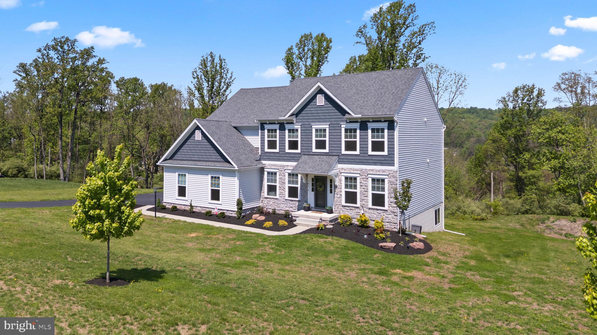 OPEN HOUSE Friday June 5th from 5pm-7pm! Stunning 4-bedroom, 2 full and 1 half bath home in the desirable Twin Valley School District! This practically BRAND NEW home offers beautiful finishes and thoughtful design choices throughout. The impressive 2-story great room features a floor-to-ceiling stone fireplace and abundant natural light.

The main level includes a formal dining room, formal living room, and an additional flexible space perfect for a home office, playroom, or sitting area. The bright and stylish kitchen features white cabinetry, subway tile backsplash, stainless steel appliances, a large island with seating for three, an oversized pantry, and an additional dining area with access to the rear deck.

The spacious primary suite offers a large ensuite bathroom with an upgraded tile shower.   3 additional bedrooms and another full bath and upstairs laundry complete this level. 

The walkout basement includes a rough-in for a future bathroom, providing endless possibilities for additional finished living space.

Situated on 1 acre, this immaculately maintained home offers breathtaking views from the back deck and an exceptional combination of space, style, and location! Twin Valley Schools!