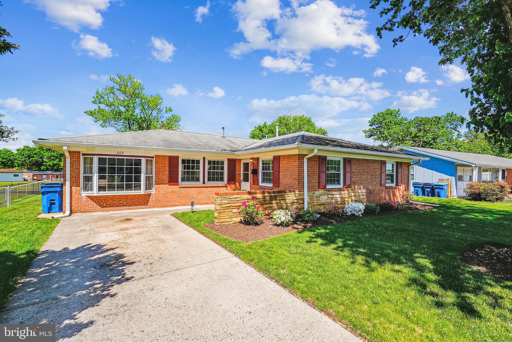 When a well maintained, fully brick move in ready home on a flat, level fenced lot meets a versatile floorplan all on one level and an awesome location, you have the perfect place to call home! Welcome to Sterling Park where buyers will be surrounded by serene views and peaceful living in the heart of Sterling. This 3 bedroom, 2 full bathroom sunny single family home with a two car driveway welcomes you with parquet and carpeted flooring and a nice sized coat closet. The floorplan flows easily into the living and dining areas where you will see plenty of windows to soak in the sunshine, chair rail, crown molding  and a chandelier. Entertain in your nostalgic family room with paneled walls, bay window, carpeted flooring & recessed lighting.  A huge additional flex room can be found with carpeting, vaulted ceiling, chair rail, exposed brick wall, additional freezer, three large sunny windows and outside access to  a gorgeous yard overlooking beautiful views of a mature tree and storage shed on a flat, level fenced lot that will please the most discriminating buyers! Shed comes equipped with electricity, shelves for storage, peg board and cabinets.  After taking in the views , head to the  kitchen to check out the crown molding, ceiling fan with lights, vinyl flooring, laminate counters, pecan cabinetry with under cabinet lighting, aluminum double sink with disposal, white appliances including a refrigerator, 4 burner electric stove and range hood, microwave, plenty of cabinet and counter space and a brick backsplash.  Head into the  primary suite where you can enjoy relaxing evenings and  where you will find crown molding, chair rail, two sizable closets, parquet flooring, two windows and access to a full bathroom with shower/tub combination, single vanity, vinyl floors and medicine cabinet.  Further down the hallway you will find two additional bedrooms soaking up the sun with two windows each and decent sized closets, chair rail and crown molding, carpet and parquet floors.  The full hallway bathroom adjacent to the two bedrooms has a tub/shower combination, single vanity, medicine cabinet and vinyl flooring.  An additional flex space can be used as an office, exercise room, craft room or anything else that you can imagine.  One of the unique features of this home is the versatility of the floorplan to accommodate your needs.  There are three flex rooms in this home that you can use as you see fit.  Storage galore including several closets throughout and a sizable storage room adjacent from the family room.  Although this home is dated and is being sold in as-is condition, it has been meticulously maintained by proud owners, is in move-in ready condition, has excellent curb appeal and most furniture can convey if the purchaser would like. Home is located a short  distance to serene Claude Moore Park! Enjoy sports center with indoor pools, rock climbing wall, gym with track, hiking and nature trails, picnic areas, nature's wildlife, historic children's museum and peaceful fishing ponds. Convenient to numerous shopping and entertainment options including plazas and malls, Dulles Town Center, One Loudoun, Leesburg Premium Outlets, movie theatres, doctor offices and INOVA Loudoun Hospital. Commuting is easy! Close to Routes 7 and 28, Dulles Toll Road, Dulles Greenway, Fairfax County Parkway and the silver line metro station. Welcome Home!