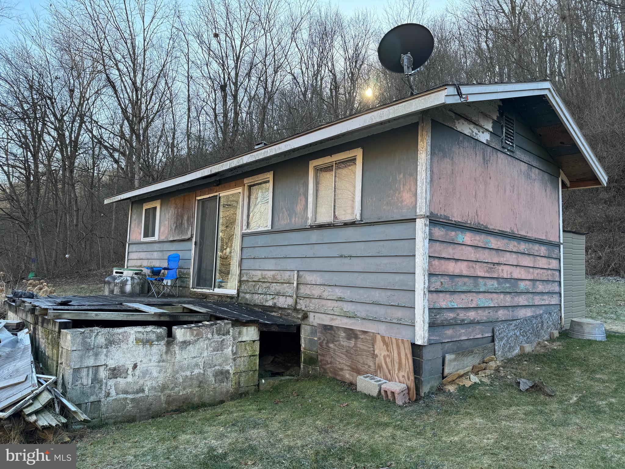 Come take a look at this 2 bedroom rancher on 2+ acres in Felton. The nice wooded lot makes it feel completely private with no other houses around. Use the land to build your dream oasis, as the house has large potential with a complete reno! If you're looking for land in Red Lion, this is your opportunity!