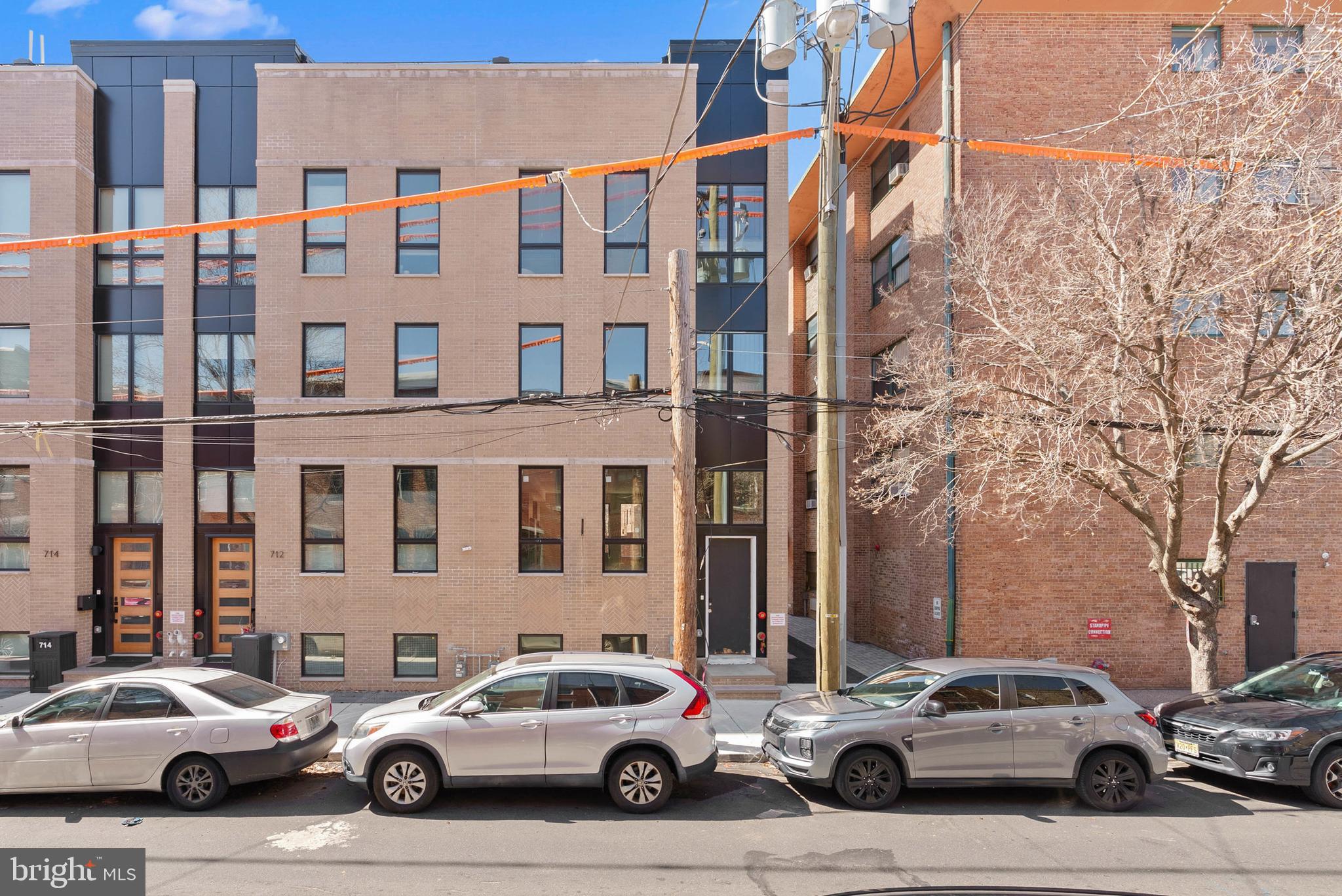 LAST HOME LEFT at Artist Village!  Located at the corner of 17th & Bainbridge Streets in the heart of historic Graduate Hospital, this stunning 20-foot-wide residence offers the perfect blend of modern luxury and timeless design PLUS the ORIGINAL ten year tax abatement! Designed by award winning JKRP Architects, the home is thoughtfully laid out to maximize both form and function, with every detail carefully considered. A handsome brick façade welcomes you at the exterior, while inside, the main level opens to a bright living and dining area, filled with natural light from tall windows. The chef’s kitchen is the centerpiece of the home, featuring Beautiful Bosch appliances, custom cabinetry, and designer finishes that make it as functional as it is beautiful. The lower level includes a private two-car garage and a bonus space ideal for a home theater, playroom, or gym. An elevator provides convenient access to all levels. On the second floor, you’ll find two spacious bedrooms, two full bathrooms, and a laundry room. The entire third floor is dedicated to the luxurious primary suite—a private retreat with a sun-filled bedroom, a custom walk-in closet, and a spa-like bathroom with a double vanity, soaking tub, rainfall shower, and water closet. Topping off this home is a spectacular bi-level roof deck. Complete with a wet bar and powder room in the pilot house, it offers expansive outdoor living space and panoramic views of the city—perfect for entertaining or relaxing. This one-of-a-kind residence combines modern smart-home technology, private parking, and elevator convenience, all within one of Philadelphia’s most sought-after neighborhoods.This highly sought-after Graduate Hospital location earns a Walk Score of 97! Nearby, South Street is lined with local restaurants, shops, and markets. Fine dining, luxury shopping, and lively entertainment can be found in neighboring Rittenhouse Sq, plus Target, Sprouts Farmers Market, and Wine & Spirits are less than a 10-minute walk. This central location also provides easy access to Broad St, Washington Ave, Jefferson Hospital, Pennsylvania Hospital, University City, and I-76. Artist Village presents a rare opportunity not to be missed. The time is now to reserve your home, customize your finishes, and plant your roots in Graduate Hospital's next chapter. The top floor flex space can easily be converted into a fourth bedroom; a door can be added for privacy. Association fees, taxes and square footage are the responsibility of the buyer to have verified independently. The PAR Standard Agreement of Sale for New Construction of sale must be used for new construction properties whether completed or not. *Photos are of a similar home. Home is expected to be completed  Q2 2026. Association fees, taxes and square footage are the responsibility of the buyer to have verified independently. The PAR Standard Agreement of Sale for New Construction of sale must be used for new construction properties whether completed or not. *Photos are of a similar home. Home is expected to be completed  Q2 2026.