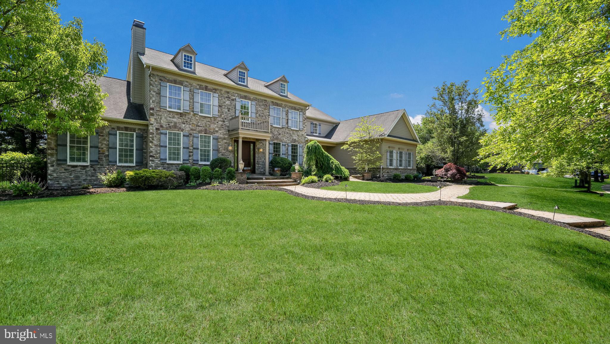Don’t miss this rare opportunity to own the former model home in the prestigious Spring Valley Estates, located in scenic Buckingham Township, Bucks County, PA. This exceptional residence, part of the award-winning Central Bucks School District, combines luxury, comfort, and impeccable design. As the original model home, it showcases a wide array of premium upgrades and high-end finishes throughout, offering a unique blend of elegance and modern functionality in one of the area’s most sought-after communities.
Inside, you’ll find four spacious bedrooms and five and a half beautifully appointed bathrooms. The gourmet kitchen is a standout feature, equipped with GE Monogram appliances and thoughtfully designed for both everyday living and entertaining. Rich Brazilian Cherry hardwood floors add warmth and sophistication, flowing seamlessly through the main living areas. The exquisite marble master bath features a luxurious rain shower, creating a spa-like experience in the privacy of your own home.
The finished lower level offers an impressive extension of the living space and includes a full bathroom, a TV viewing area, a large custom bar perfect for entertaining, and plenty of room for a game room or recreational space. In addition, there is ample storage throughout, making this level as functional as it is inviting.
Step outside into your private backyard oasis. Enjoy an outdoor fireplace, beautifully designed hardscaping, and lush professional landscaping. The highlight is the resort-style pool, complete with a relaxing hot tub and a fun slide for all to enjoy, making it the perfect setting for both relaxation and recreation.
This is more than just a home, it’s a statement of style and sophistication in one of Bucks County’s most desirable locations. Schedule your private showing today to experience everything this remarkable property has to offer.