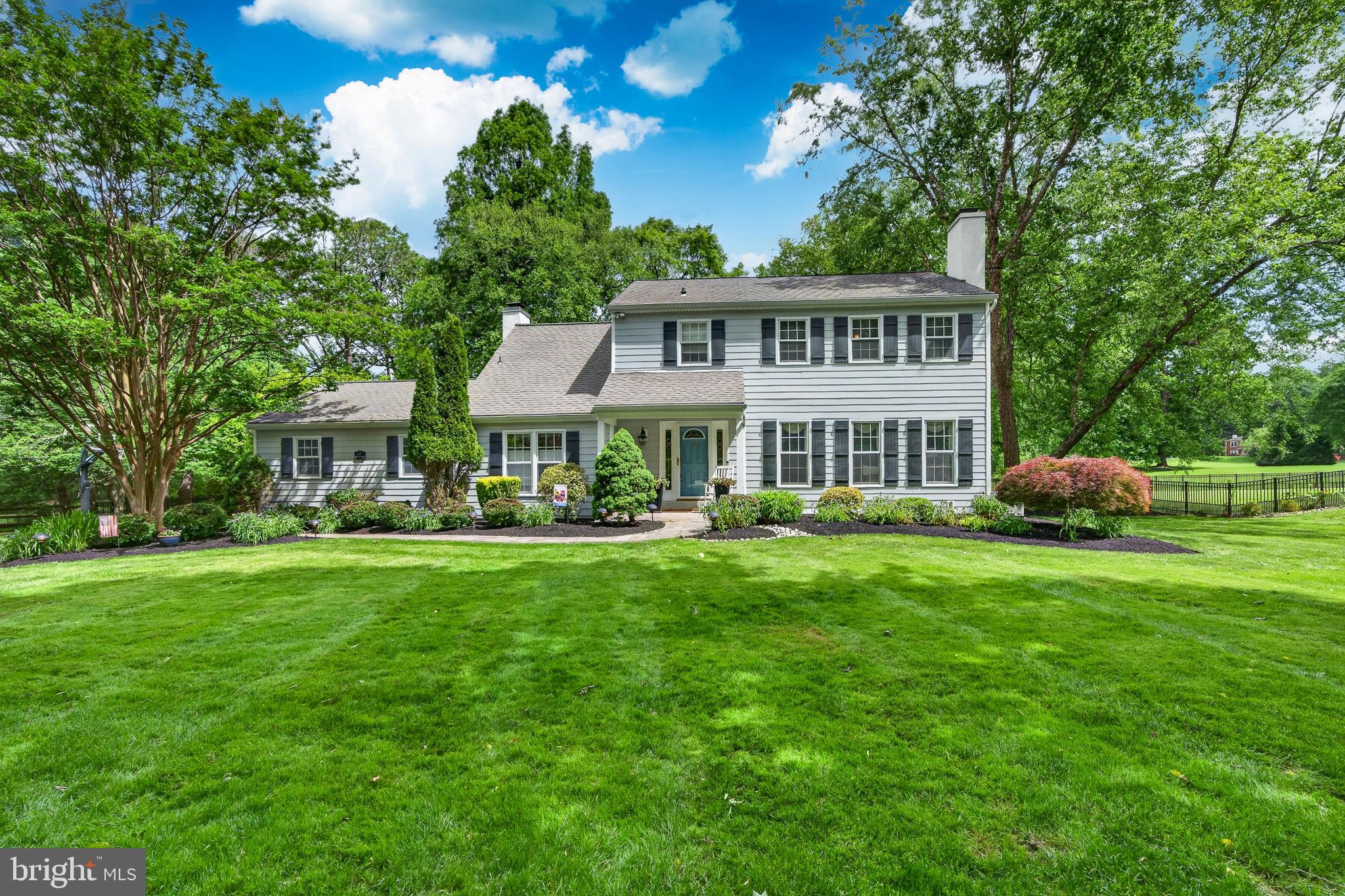 Welcome to 925 Saint Andrews Drive — a beautifully maintained home tucked at the end of a quiet cul de sac, surrounded by mature landscaping and exceptional curb appeal. The stone walkway, charming front porch, Hardie board siding, and thoughtfully designed gardens set the tone before you even step inside. The tiled foyer opens to a spacious laundry/mudroom with abundant cabinetry, countertop space, and a utility sink. Opposite the laundry room is a comfortable living room featuring a brick hearth fireplace — the perfect spot to unwind on cooler evenings. The heart of the home is the stunning, newly renovated kitchen and breakfast area. This space delivers true “wow” factor with a large quartzite island that seats six, a farmhouse sink, pendant lighting, recessed lighting, and custom white cabinetry crafted by skilled carpenters. Additional highlights include matching quartzite countertops, 42” cabinets, subway tile backsplash, a 6 burner gas range with pot filler, convection microwave, stainless steel appliances, and a dedicated coffee/dry bar with wine refrigerator. The breakfast area overlooks the pool and offers plenty of room for a full size table. Just off the kitchen is a bright and inviting family room with vaulted ceilings, a gas fireplace with floor to ceiling brick surround, plush carpeting, ceiling fan, and large windows that fill the space with natural light. Sliding glass doors lead directly to the home’s main entertainment hub — the backyard oasis. The recently updated, heated pool features underwater lighting, built in seating, and a diving board. The outdoor area also includes a large hot tub, awning, built in natural gas grill (no propane tanks needed), spacious patio, and yard area perfect for games like cornhole. Everything is enclosed by a sleek black aluminum fence. The home also offers a partially finished basement with a gym area and storage, along with a recently replaced gas HVAC system. Upstairs, you’ll find two well sized bedrooms with ample closet space and a beautifully updated hall bath with double sinks and tile flooring. The primary suite includes a walk in closet, ceiling fan, and a private bath featuring a walk in tiled shower with glass doors and tile flooring. The home backs up to common space which will always be open. Additional features include a whole house natural gas generator, pool heater, and an electric vehicle charging station.  This exceptional property is ideally located between two vibrant communities — West Chester Borough and Malvern Borough — each offering fantastic restaurants, shops, and small town charm. Convenient to Wegmans, Route 202, and the PA Turnpike. This home truly has it all — comfort, style, and an unbeatable location.