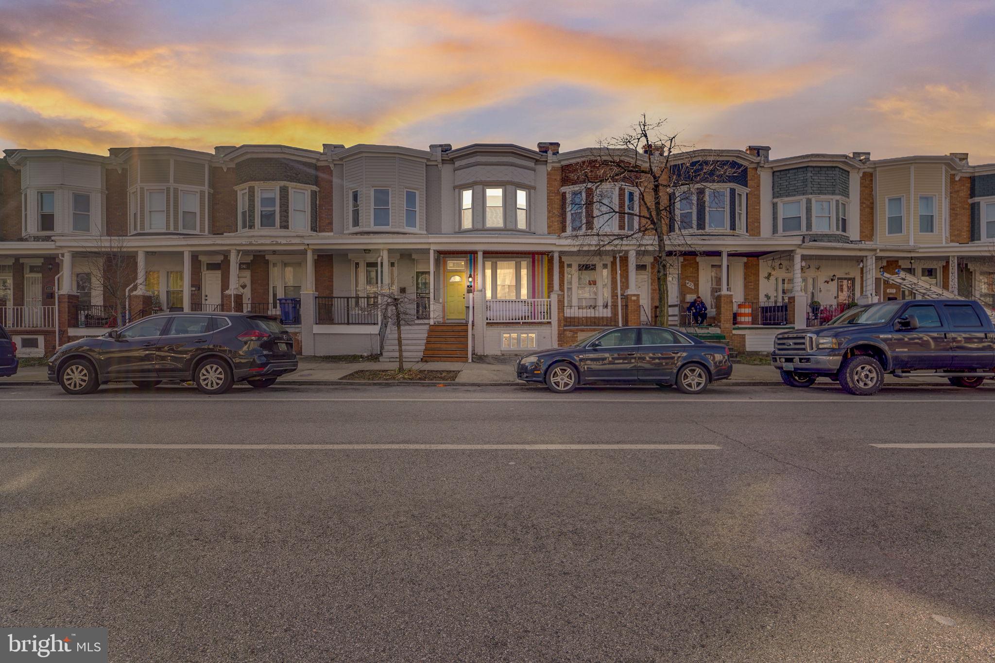 Presenting 425 E 28th Street. This 4 bedroom 2.5 bath awaits you. Spacious floor plan with flowing hardwoods, gourmet kitchen with granite counters and stainless appliances, exposed brick walls, finished basement,,  large front porch, and rear deck to relax and enjoy some fresh air.