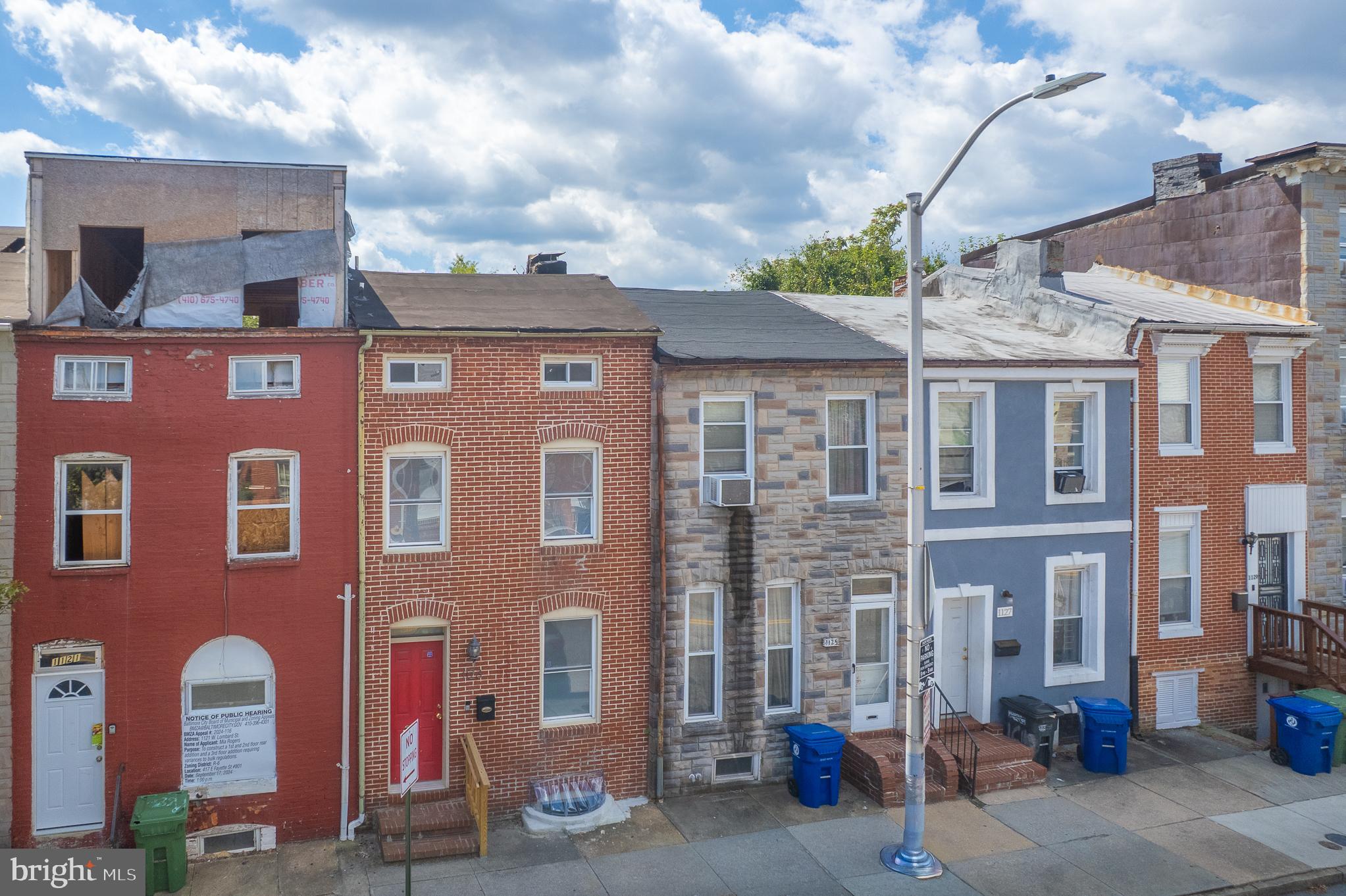 Welcome to this charming rowhome located at 1123 West Lombard Street in the vibrant Hollins Market neighborhood of Baltimore, MD. With its classic architecture, this home offers 3 spacious bedrooms and 2 full bathrooms and a half bathroom, making it an ideal space for families or roommates. The property sits on an 871 square foot lot and includes a basement, offering potential for additional living space or storage. This home is perfect for those with a vision; its current condition presents a fantastic opportunity for investment as a rental property or a personal project. Situated near the University of Maryland and the bustling Medical Center, the location attracts a diverse community seeking convenient urban living. The surrounding area boasts easy access to public transportation, local eateries, and the famous Hollins Market, adding to its rental appeal. If you’re looking to invest in a property with great rental potential or create a personalized home, this could be the perfect choice for you. Don’t miss out on this enticing opportunity to own a piece of Baltimore’s rich history. Owner financing available ask agent for details.