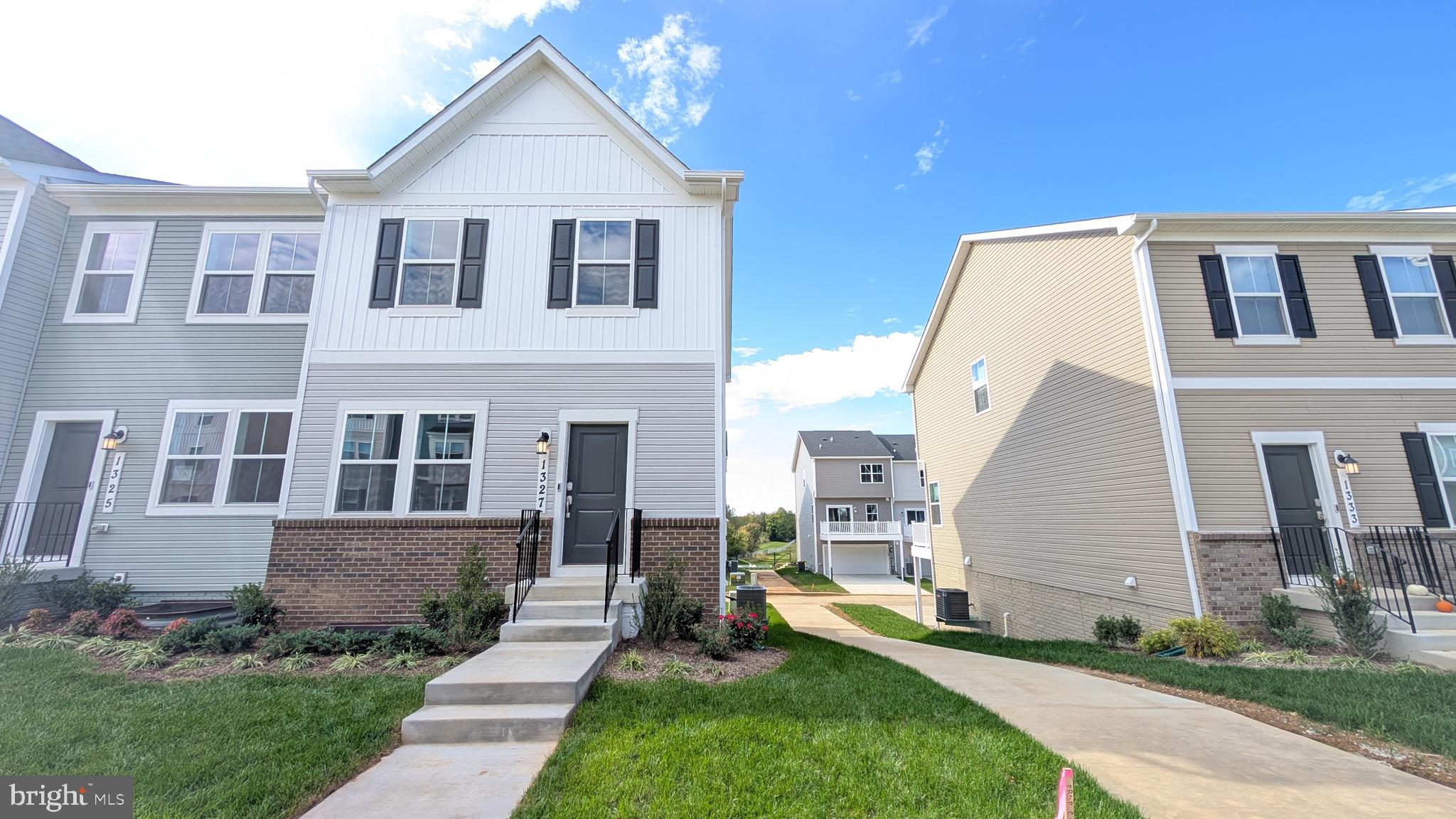 END UNIT! Welcome to Red Clover Meadows, with beautiful surroundings and great commuting options in Ranson, WV! Located just minutes away from historical sites, dining, shopping, parks, and more! The Lancaster Townhouse model is a 3-level home. The first floor is host to a recreation room with a powder room plus access to the rear load 2-car garage. Upstairs, an inviting open floorplan includes the spacious Great Room, dining area and chef-inspired kitchen with a conveniently placed powder room. The kitchen is suited with Caramel Fantasy granite countertops, Barnett DuraForm cabinets in Harbor, and a spacious 10x18 deck! All bedrooms can be found on the top level, including the luxe owner's suite, which features a relaxing bedroom, en-suite bathroom and generous walk-in closet. Washer and dryer included