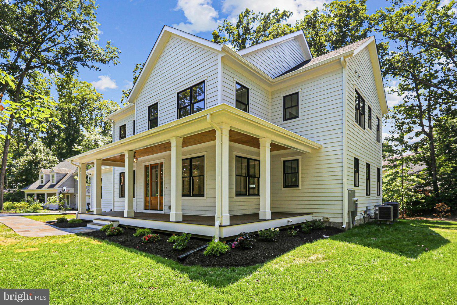 JUST COMPLETED! Stunning new craftsman style home in the heart of Fort Hunt's Waynewood school district. A striking exterior with black windows, white siding, and standing seam metal roof harken back to a bygone area. Sited impressively on a corner lot, this home says "home." Step inside and find anything but the ordinary. Large open layout allows for casual space for daily life while providing seamless flow for large-scale entertaining. Soaring ceilings, hardwood flooring and built-ins all combine to provide the character you want. Huge chef's kitchen is the heart of the home with 48" range, built in refrigerator and tons of custom cabinetry. Butler's and separate large pantry room ensure you have plenty of space to serve guests and hosts functions. The main level also has a large mudroom with built-ins, bedroom with ensuite bathroom (easily used as an office) and telescoping doors that allow the outdoors in on your glorious deck. Upstairs, there are 4 generous bedrooms with walk-in closets, hardwood floors, and 3 full bathrooms. A spacious laundry room also helps keep the clothes where they belong. The primary suite is well appointed with extensive moldings, gorgeous white oak flooring, and relaxing sitting room, two walk in closets and a lux marble bath with dual sinks and soaking tub. With so much space, it's easy to focus on preparing and unwinding from your day. The lower level has a large recreation room, work-out room, 6th bedroom, 5th full bathroom and tons of storage space. A second gas fireplace adds comfort and ambiance to this level.

Outside, you will find yourself within walking distance to Fort Hunt's local shopping. Drycleaning, grocery, pharmacy, a hardware store and a variety store are all just a block away. The GW Parkway with its miles of bike trails and Potomac River views are just up the street. 

Welcome Home!