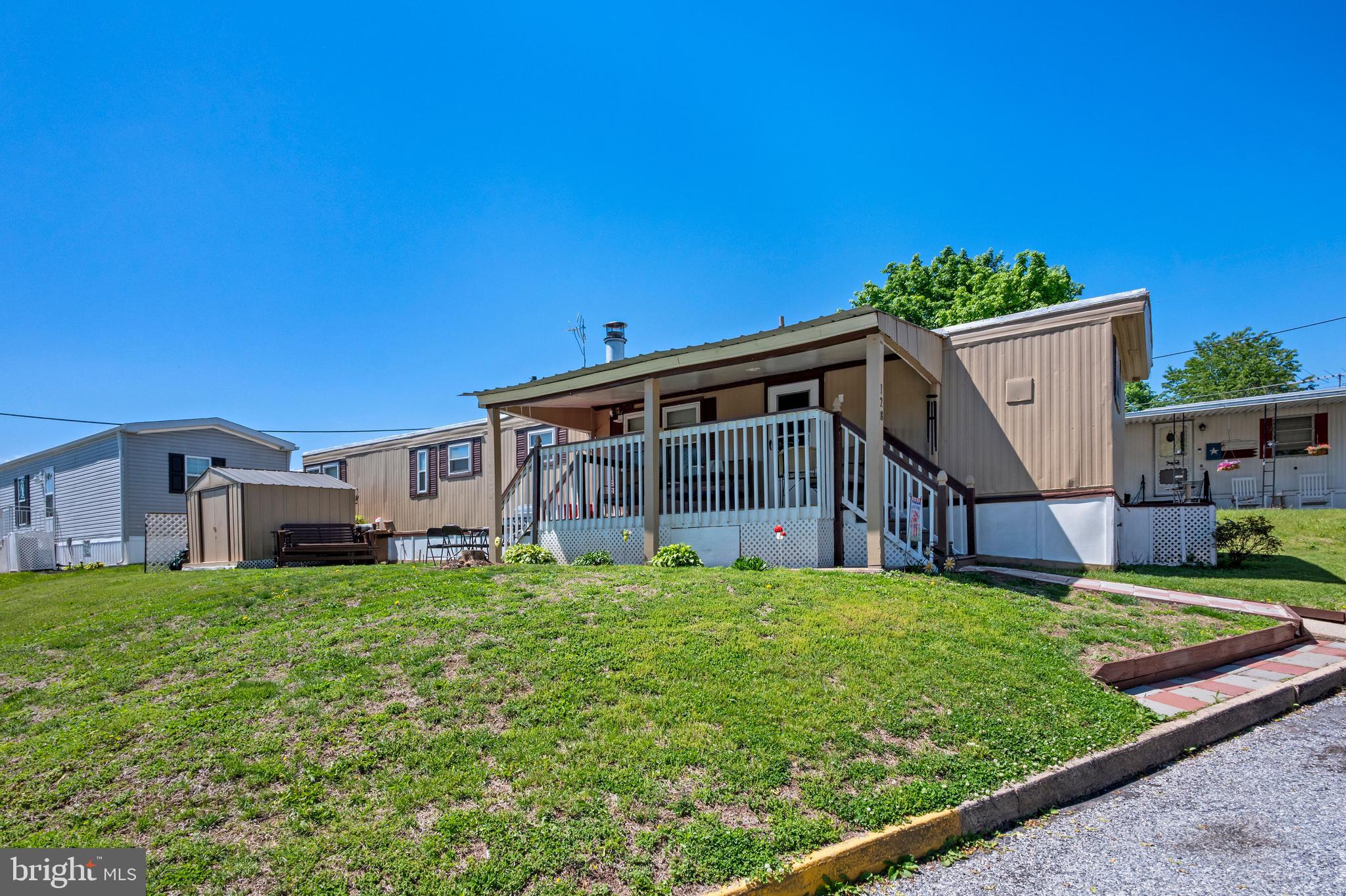Welcome to the Valley View Community! This updated and modern 2-bedroom, 1-bath mobile home offers comfortable living in a convenient location close to local amenities and major roadways.  Situated on a desirable corner lot, this home features a covered porch and front patio.  Inside, you’ll find updates throughout, creating a fresh and inviting space.  Additional highlights include a personal storage shed and easy access to everything you need, making this home both practical and appealing.   The monthly lot rent is $556 and covers sewer and trash services.