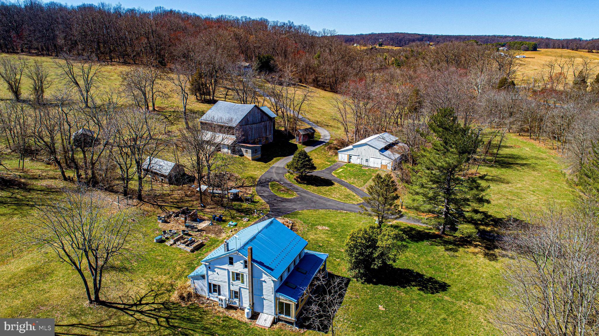 23.7 acre farmette located in Whiteford. 4 br. 2 ba. farmhouse with wrap around porch and sun room. Main level includes kitchen, dining room, living room and family room with stone fireplace with insert and a full bath. Second level has 3 bedrooms a laundry room and a full bath. Third floor has one bedroom and a sitting room. Property includes a bank barn and additional 55x52 building with work shop and 6 stalls. Great property for animals with pasture, stream and pond. Please call for details.
