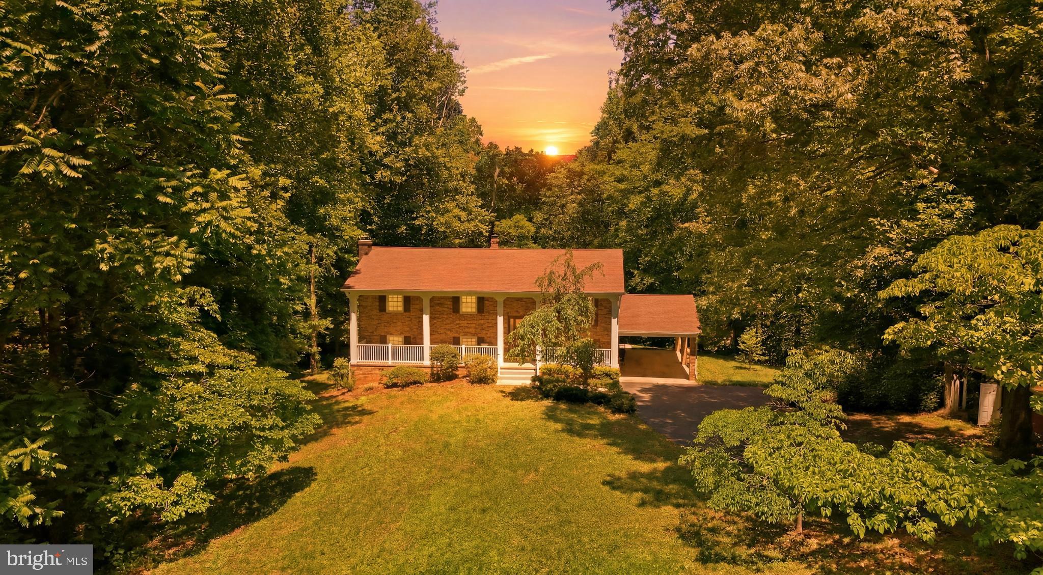 Welcome to your own private retreat! This beautiful all-brick split foyer home sits on 7 acres at the end of a quiet cul-de-sac, offering space, privacy, and endless possibilities.

Featuring 4 bedrooms and 3 full baths, this spacious home offers room to spread out both inside and out. The fully finished basement showcases a stunning stone fireplace, creating the perfect cozy gathering space for entertaining or relaxing evenings at home.

Enjoy peace of mind with a brand-new air conditioning system recently installed. Outside, stately mature trees surround the property, providing exceptional privacy, natural shade, and a serene backdrop for relaxing on the spacious deck. The oversized front porch is perfect for summer daydreaming, morning coffee, or winding down at sunset.