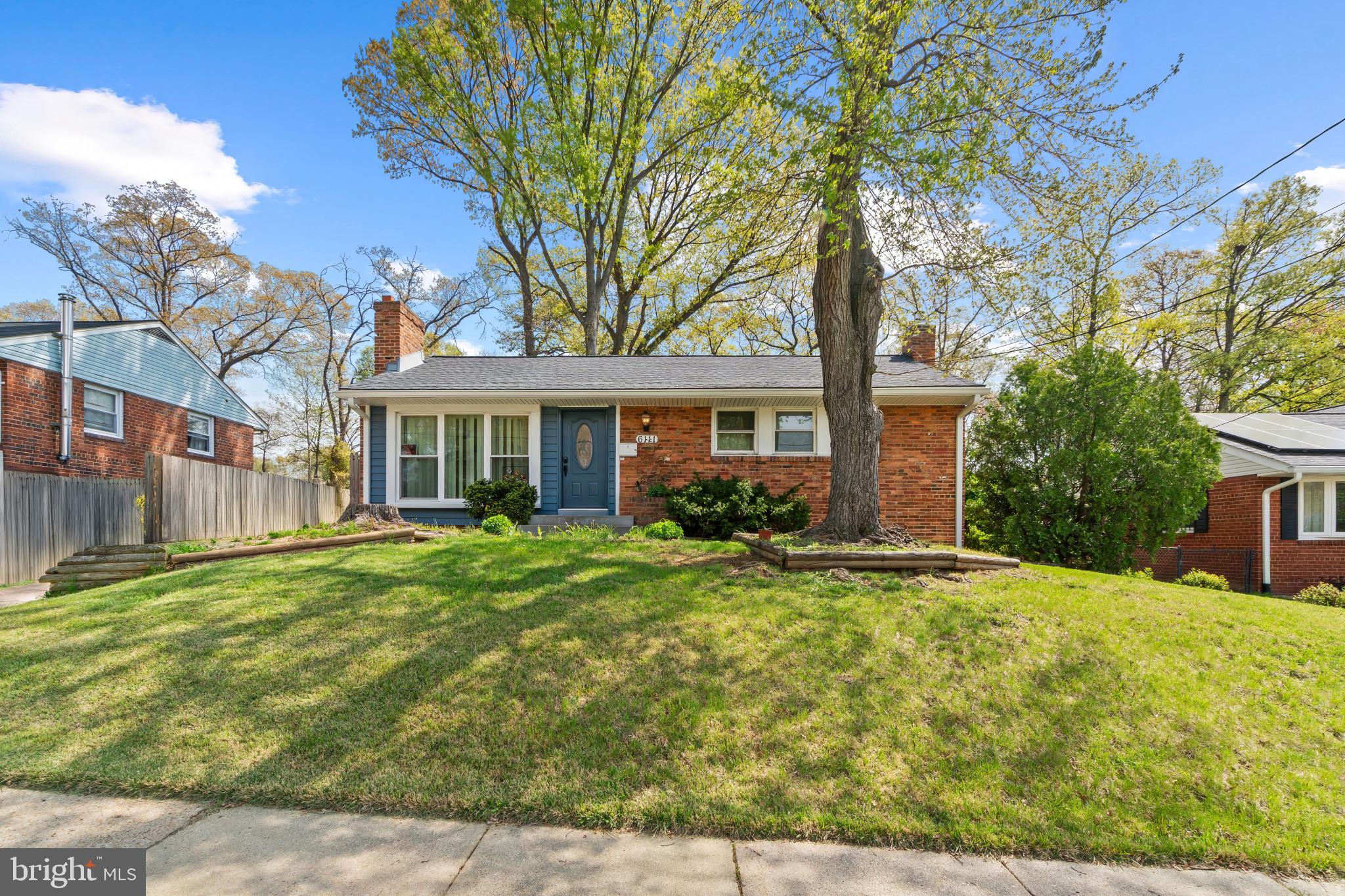 Spacious Rancher offering 3 bedrooms, 2 full bathrooms, and 1,150 finished square feet in New Carrollton. The main level offers a functional layout with a living room featuring a wood-burning fireplace, a separate dining room, and an eat-in kitchen with space for a breakfast area, highlighted by a large bay window that brings in natural light. Continuing on the main level are three comfortable bedrooms, including the primary bedroom, along with a well-appointed full bathroom and convenient main-level laundry. The finished lower level features recently installed tile flooring and provides a large additional living space, including a second wood-burning fireplace, a walk-in closet, and a recently updated full bathroom. The level also includes a bonus room, unfinished storage space, and a second laundry area. Exterior features include a fenced backyard, storage shed, and extended driveway for additional parking. Conveniently located near shopping, dining, and major commuter routes.