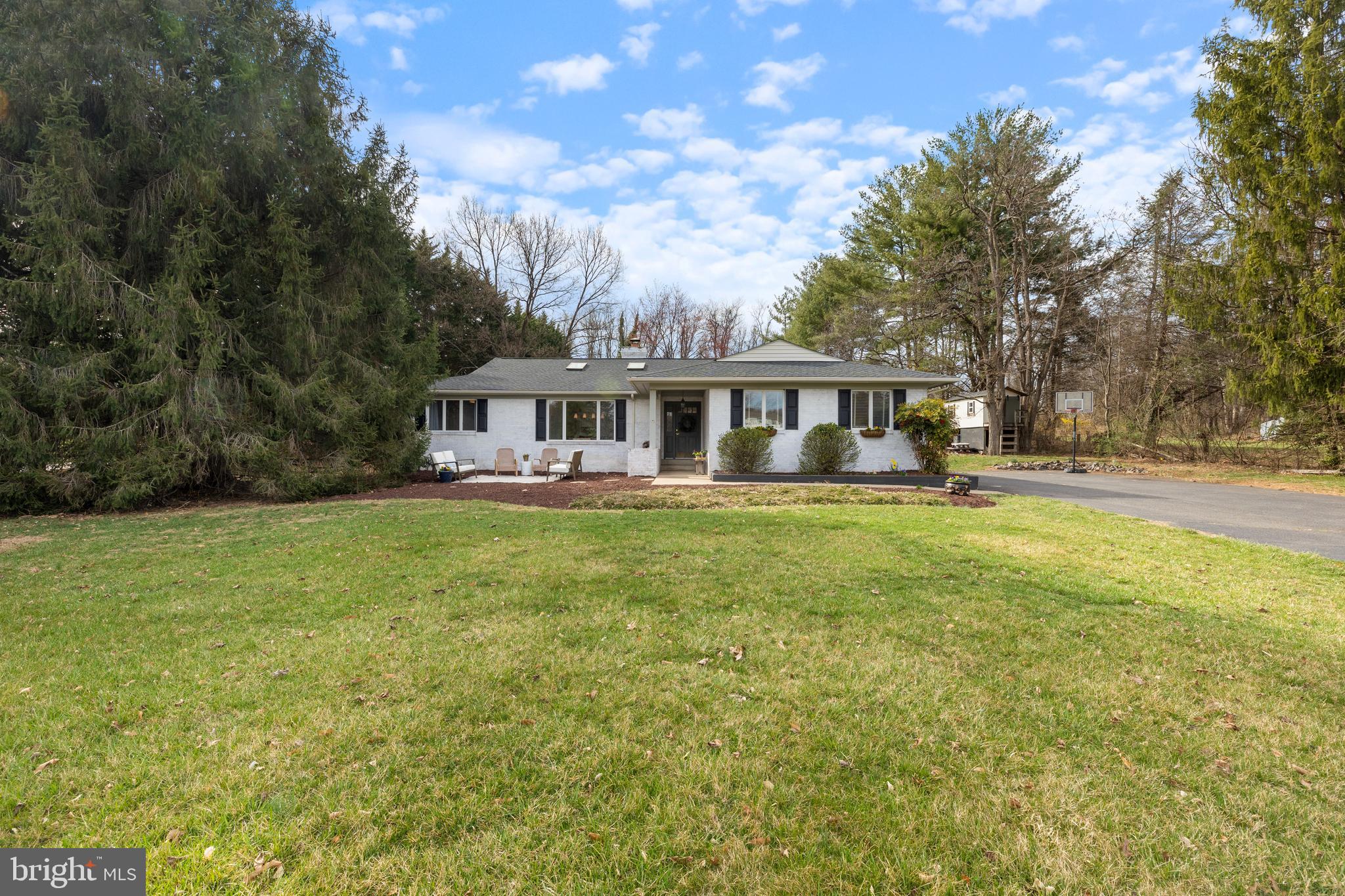 Welcome to this stunning ranch-style home, a perfect blend of comfort and modern living, nestled in a serene cul-de-sac setting. Built in 1986 and extensively renovated in 2019, this property boasts 2,783 sq. ft. of meticulously maintained space, featuring 3 spacious bedrooms and 2.5 bathrooms. The interior showcases an open floor plan, complemented by recessed lighting and skylights that flood the space with natural light. The gourmet kitchen is a chef's dream, equipped with stainless steel appliances, including a six-burner commercial range, 2 dishwashers and energy-efficient options. Enjoy meals at the kitchen island, while the adjoining dining area is perfect for entertaining. The primary suite offers a 2 closets along with a luxurious walk-in closet.  Step outside to your expansive 1.68-acre lot, where tranquility meets nature. The property backs to lush trees, while the level yard is ideal for outdoor activities. Enjoy views of the garden and surrounding greenery from your deck, perfect for morning coffee or evening gatherings. Conveniently located less than 10 miles from the airport and within close proximity to commuter lots, this home offers easy access to transportation and major routs 15, 29, 66 and 50. Additional features include a  finished basement, a brick fireplace, and ample parking with a paved driveway. This exceptional property is ready to welcome you home!