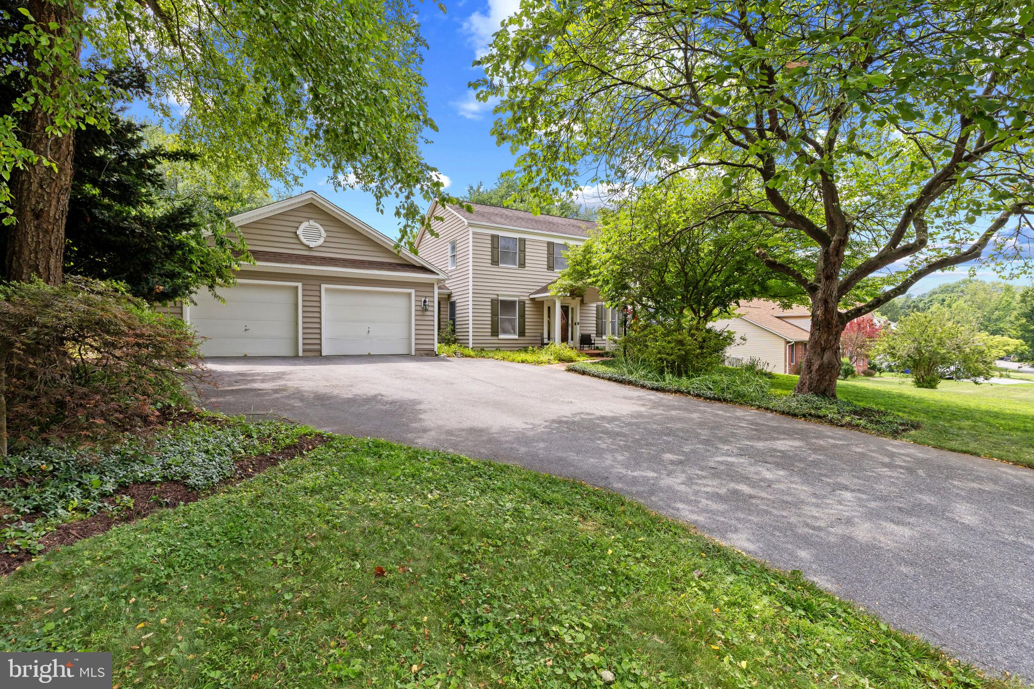 Spacious Colonial residence offering 4 bedrooms, 3.5 bathrooms, 2,652 finished square feet, and a 2-car garage in established Chateau Valley. Designed with flexibility in mind, this unique property features a desirable main-level suite, expansive outdoor living spaces, and an inviting layout ideal for a variety of living arrangements. // The traditional main level begins in a welcoming foyer with a convenient powder room nearby. To one side, the formal living room is filled with natural light, creating an inviting space for gathering. Opposite, the formal dining room is enhanced by a timeless chandelier, providing an elegant setting for meals. At the heart of the home, the open-concept living area is designed for both everyday comfort and entertaining. The family room offers exterior access and flows seamlessly into the eat-in kitchen, which features a center island with breakfast bar seating, stainless steel appliances, abundant counter space, and charming cabinetry. // French doors lead to a remarkable main-level suite that offers exceptional privacy and versatility. This separate wing includes a spacious living area with bay windows, soaring vaulted ceilings, and private exterior access. The suite also features a generously sized bedroom and a well-appointed full bathroom with a large walk-in shower and built-in bench seating. With both interior and exterior access, the space can function as privately or as openly as desired, making it ideal for multigenerational living, an in-law or guest suite, a private primary retreat, an au pair arrangement, or other flexible lifestyle needs. // The upper level offers three additional bedrooms, including a suite with a private attached full bathroom showcasing custom tilework. A third full bathroom in the hallway serves the remaining bedrooms. The lower level provides abundant storage and future potential with a largely unfinished basement, while a finished bonus room offers the perfect space for a home office, exercise room, hobby area, or additional flex space. // Outdoor living is a true highlight of the property. The backyard retreat features an in-ground pool with a built-in hot tub, surrounded by multiple patio and deck areas designed for both entertaining and relaxation. One outdoor gathering area includes a built-in bench and partial overhead covering, while another is enclosed with fencing for added safety. Overlooking it all is a lush, spacious fenced backyard that provides plenty of room for recreation and outdoor enjoyment. Additional highlights include rooftop solar panels, offering energy efficiency and potential utility cost savings. // Select photos are virtually staged for illustrative purposes only.