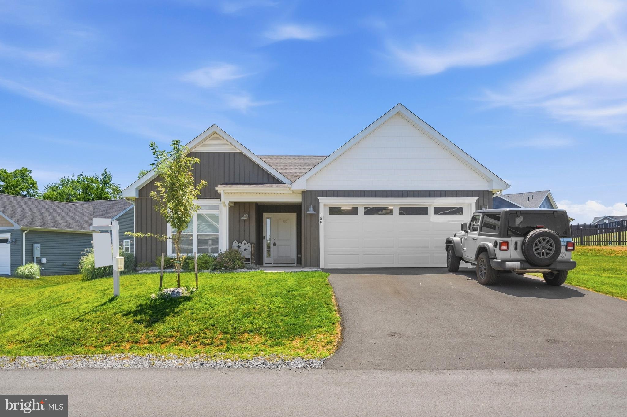 Built in 2024 by Panhandle Homes of Berkeley County, this beautifully designed ranch-style home offers modern comfort, quality craftsmanship, and low-maintenance living. Nestled at the back of the desirable Harvest Glen community near a cul-de-sac, you'll enjoy a peaceful setting with added privacy.

Enter inside to find a thoughtfully designed floor plan featuring three spacious bedrooms and two full bathrooms. The Primary Suite is a true retreat with dual closets, while bedrooms two and three each offer their own walk-in closets, providing exceptional storage throughout the home. The luxurious Primary Bath features a dual vanity, a 5-foot walk-in shower, and a convenient linen closet.

The stunning kitchen is the heart of the home, showcasing 42-inch soft-close cabinetry in a beautiful Painted Vanilla finish, Level 3 granite countertops, and an oversized island with side and end overhangs—perfect for meal prep, entertaining, or casual dining. A stylish ceramic tile backsplash and stainless steel, energy-efficient GE appliances complete this impressive space.

Additional highlights include an attached two-car garage, a high-efficiency Trane HVAC system backed by a 10-year manufacturer's warranty, and the added peace of mind of a one-year builder's warranty.

Don't miss your opportunity to own this nearly new home in a fantastic location. Schedule your private tour today!