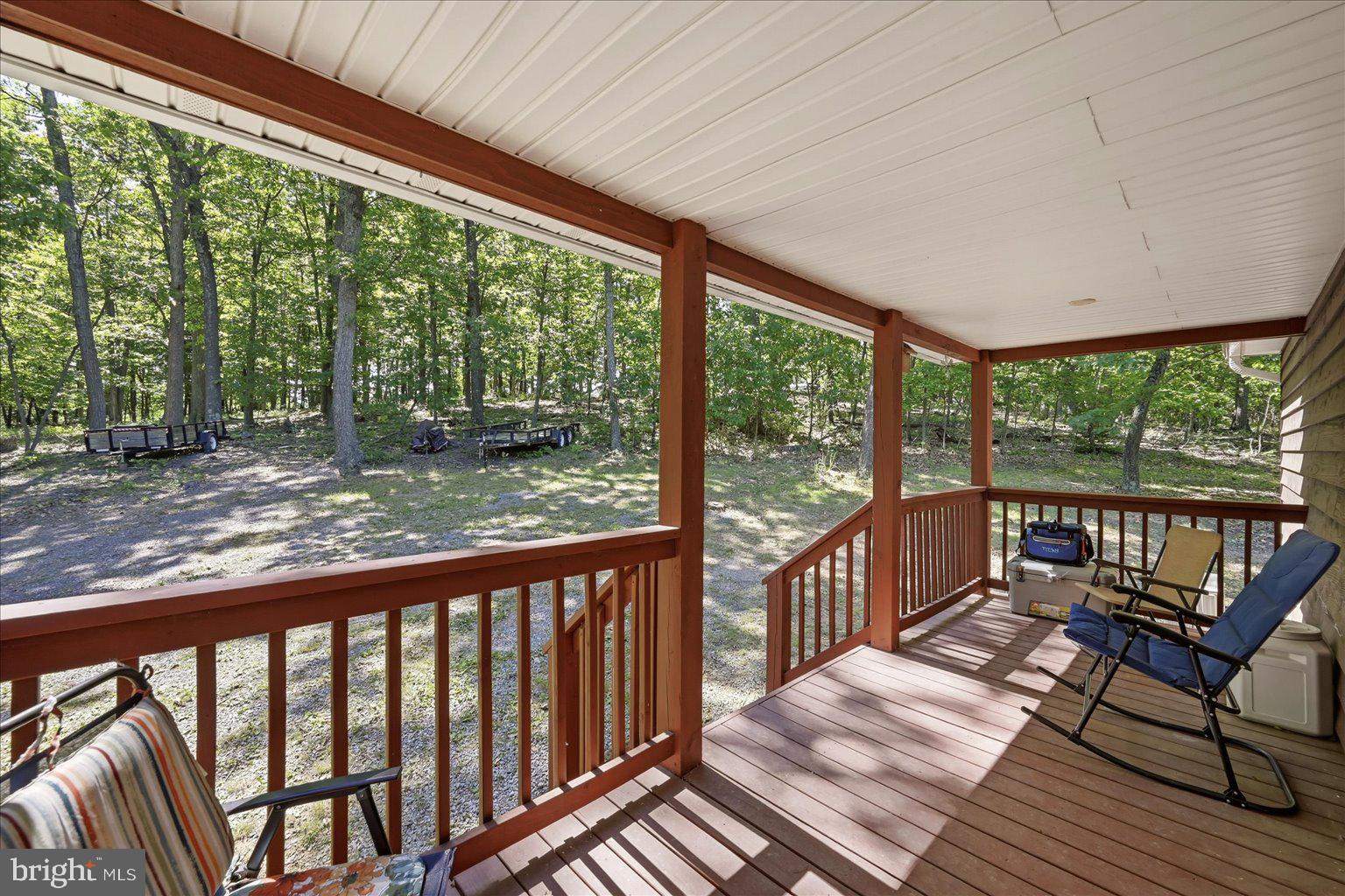 Beautiful property with so much to offer! The main home features fresh paint, refinished hardwood floors, a beautiful etched-glass front door, and a new French door leading to the rear deck. Enjoy the full front porch, perfect for watching wildlife or sharing great conversation. The kitchen offers newer upgraded appliances and a huge deep sink. A split-bedroom design provides privacy and functionality.
The full basement includes a recreation room, workshop with extra ventilation, large laundry/storage area, and half bath. The 3-car garage is exceptionally versatile with expanded 200-amp electric service, four 50-amp welder plugs, and a 30-amp air-compressor plug. Above the garage is a 1-bedroom apartment with its own front porch and vaulted living ceiling.
An outdoor wood/coal-burning furnace adds off-grid appeal. Additional features include 2 HVAC systems, 2 water heaters, 2 water softeners, and 2 generator hookups. Come see this beautiful property and fall in love!