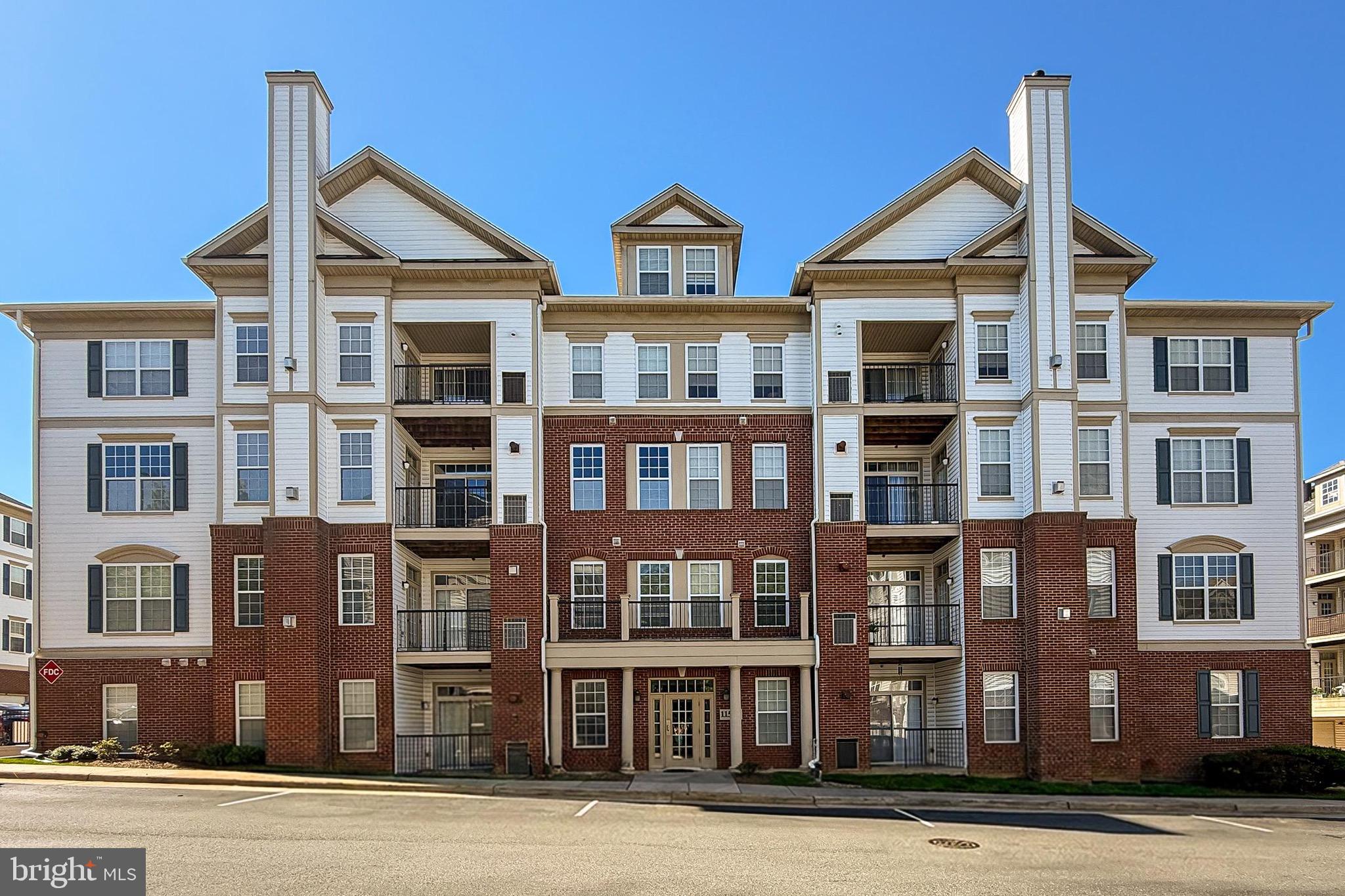 Beautifully maintained and move-in ready, this pristine 2-bedroom, 2-bath condo offers approximately 1,200 square feet of comfortable, low-maintenance living. Located in a secure, elevator-access building, the unit includes a private one-car garage and a covered driveway for a second vehicle.
The bright, open-concept interior features soaring ceilings, abundant natural light, and plush textured carpeting throughout. The stylish white kitchen showcases a classic subway tile backsplash, ample cabinetry, and a clean, timeless design, while a full-size in-unit washer and dryer add everyday convenience.
Designed with privacy in mind, the split-bedroom floor plan places the bedrooms on opposite sides of the home, each featuring a spacious walk-in closet. Step outside to your private balcony, the perfect place to relax and enjoy the fresh air.  Water and trash is included and there is a trash chute by the elevator.  The unit is close to but not next to the elevator and the trash chute for convenience and privacy.
Enjoy nearby walking and biking trails, along with exceptional access to shopping, dining, and everyday conveniences. Ideally situated just minutes from Wegmans, Costco, major roadways, and countless restaurants and retail destinations, this exceptional condo offers the perfect blend of comfort, convenience, and location.