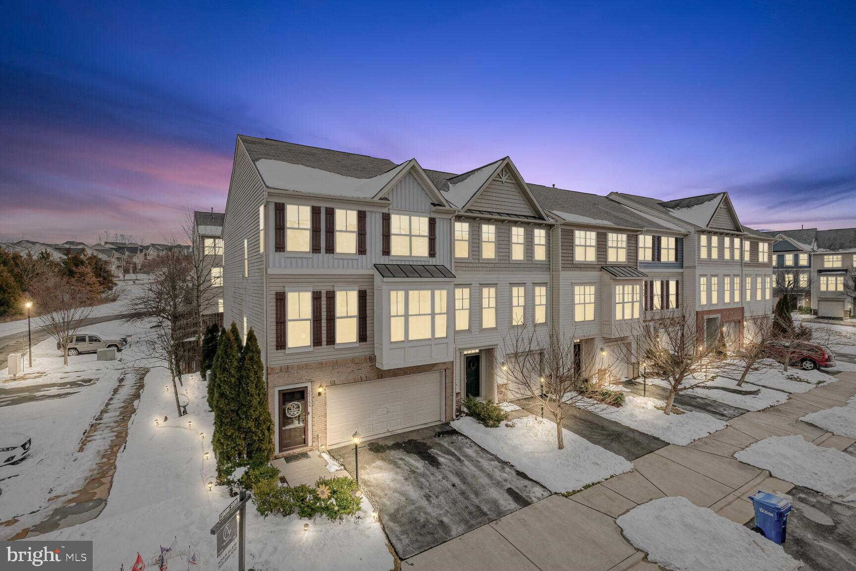 Attention All Veterans - This Home Has An Assumable VA Loan at 5.12% Contact Agent For Details - Huge 2900 Square Foot End Unit Townhome W/ 2 Car Garage In Sought After Alexander's Chase inside Broadlands! Stone Patio And Artificial Turf For Easy Maintenance, Oversized Deck with Stairs - Wood on Deck Replaced 2 Yrs Ago To Durable Trex with Night Time Lights, Gorgeous Landscaping, Fully Fenced Rear Yard, 3 Level Bump-outs, Gourmet Kitchen & Island With Granite Countertops & Built-in Buffet, Hardwood Floors On Main Level, Built-In Bookcase In Office, Primary Suite Has Its Own Sitting Room, Closets with Organizational Systems, Built-In Buffet, Crown Molding Throughout, Roof Inspected Summer Of 2023, Fully Finished Basement With A Bedroom And A Full Bath - Brand New Carpet In The Basement And The Connected Stairs Going To The Main Level, Water Heater Replaced September 2023, Refrigerator That Conveys Is A Samsung Smart Fridge With The Wifi Family Hub Integrated Screen And The Washer And Dryer Are Oversized To Handle XL Loads, Plenty Of Parking Nearby Since This Is An End Unit, Basketball, Tennis Courts And Tot Lots Are Within A 2 Min Walk From The Front Door, 65" TV Downstairs And A 55" TV In One Of The Spare Bedrooms Convey With The TV Mounts. - This Home Has So Much To Offer Including All The Amenities Of Broadlands And Its Top Rated Schools!