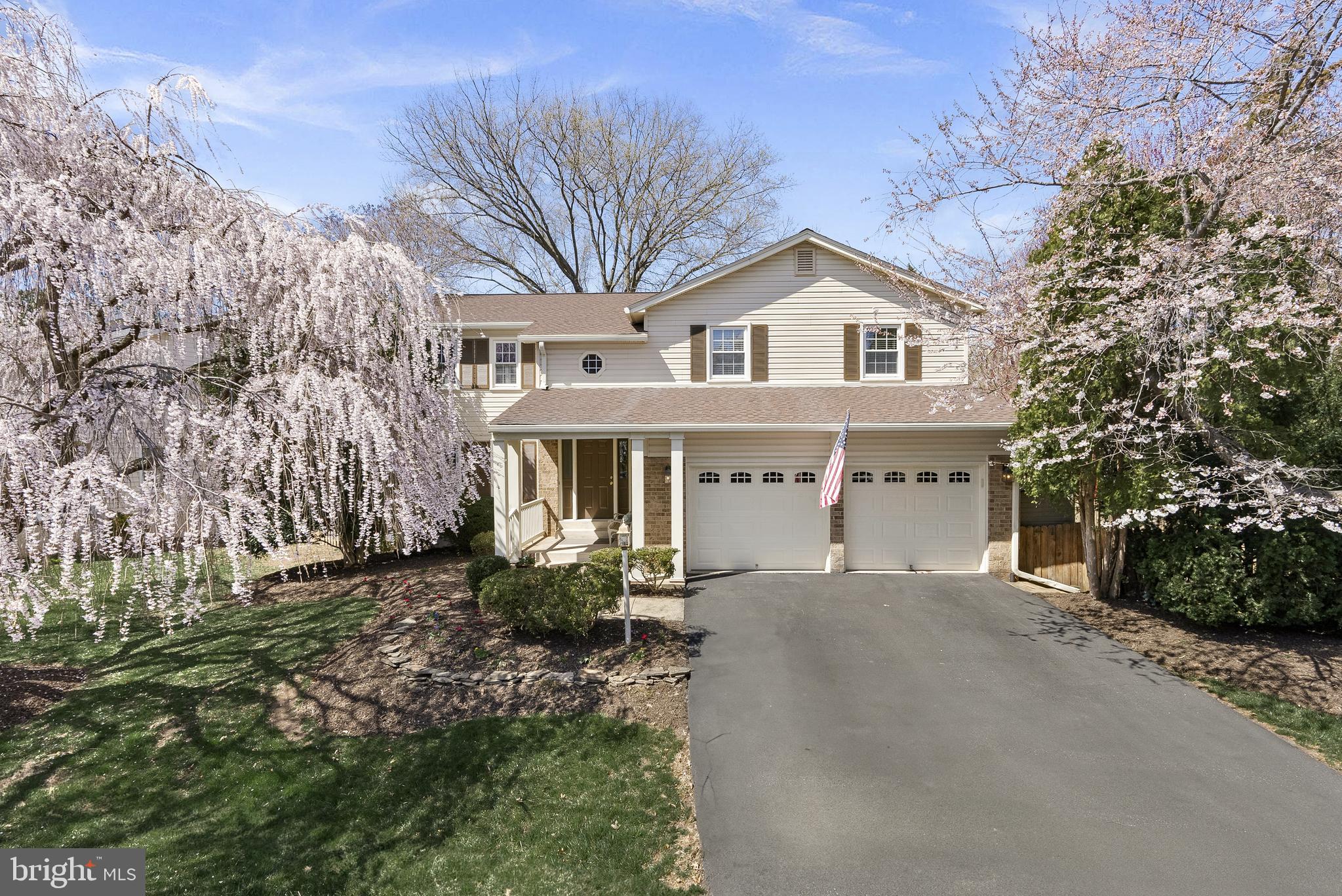 Welcome Home! This beautifully updated 5-bedroom, 3.5-bathroom colonial in the sought-after Brookfield Woods neighborhood of Chantilly offers the perfect blend of classic charm and modern upgrades. Situated on an expansive, tree-lined lot, this pristine Dogwood model by Manhattan Homes boasts over 3,500 square feet of living space across three finished levels, providing plenty of room to live, work, and entertain.

Step onto the inviting front porch and through the brand-new entry door just past the incredible cherry tree into a grand two-story foyer, where freshly refinished hardwood floors set the tone for the elegance and warmth that define this home. The thoughtfully reconfigured gourmet kitchen is a showstopper, featuring vaulted ceilings with wood beams, a spacious center island, granite countertops, and a Kenmore appliance suite, including double convection wall ovens. A bright breakfast room addition with deck access seamlessly connects to the formal living and dining rooms, while the adjacent family room—complete with a brick hearth fireplace and built-in desk area—creates a cozy yet functional space for everyday living. The powder room, updated with a brand new quartz-topped vanity, access to oversized 2-car garage, and a convenient laundry area, complete the main level.

Upstairs where all hardwood floors greet you underfoot, the spacious primary suite offers a private en suite bath, while three additional large bedrooms share an updated hall bath with a quartz vanity. A versatile loft with built-in shelving creates the perfect space for a home office, den, or game area. The finished lower level features a custom bar, rec room, spacious true 5th bedroom, and a stunning full bath with a granite vanity and oversized standing shower—ideal for guests or multi-generational living.  An entertainer’s paradise awaits outside, where an expansive newly painted deck with a hot tub, a screened porch, and a fully fenced backyard with mature trees, open space, and a custom shed provide endless options for relaxation and recreation.

With a brand-new roof (2024), fresh whole-house paint, gutter guards, a 2014 Carrier HVAC, this home is move-in ready. Located just minutes from Routes 28, 66, the Toll Road, tech corridor, shopping, dining, EC Lawrence Park, and top-rated schools,  and enjoy an incredibly low $36/year HOA. This is an exceptional opportunity to own a meticulously maintained and upgraded gem, showcasing pride of ownership from longtime owners, in an unbeatable location.