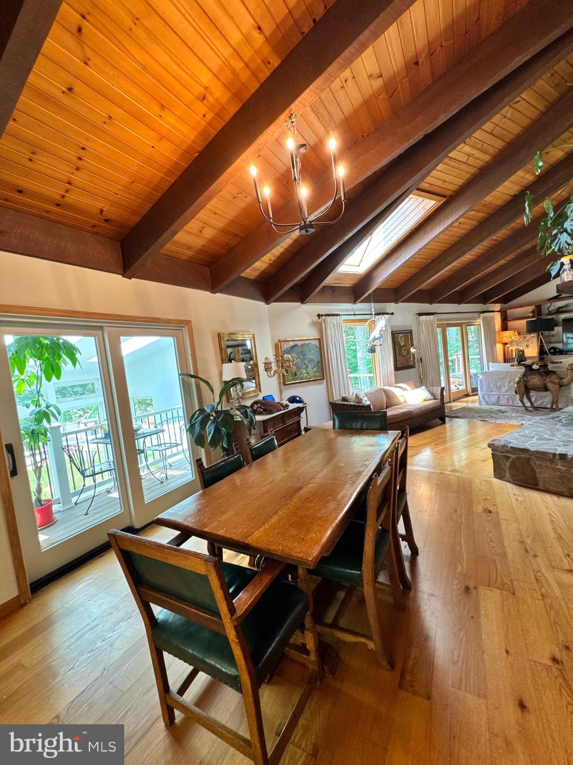 Inspired by the natural beauty of the Cunningham Falls area, this sprawling 4-bedroom, 3-bath mid-century home offers a unique combination of architectural character, versatility, and outdoor living on more than two private acres. Thoughtfully maintained with tasteful updates throughout, the home preserves the clean lines, dramatic spaces, and design elements that define mid-century architecture while incorporating the modern conveniences. Massive oak beams, a dramatic two-story solarium, updated baths, quartz countertops, and a spacious kitchen create living spaces that are both functional and memorable. Designed to embrace the outdoors, the property features multiple decks overlooking impeccably maintained landscaping, creating countless opportunities for entertaining, relaxing, or simply enjoying the surrounding setting.The walkout lower level offers exceptional flexibility with substantial finished living space ideal for multi-generational living, guest accommodations, recreation, fitness, or a work-from-home environment.

Located just minutes from Cunningham Falls and year-round outdoor recreation, this is a home that adapts to the way you live—offering architectural distinction, privacy, and versatility in a setting that is difficult to duplicate.