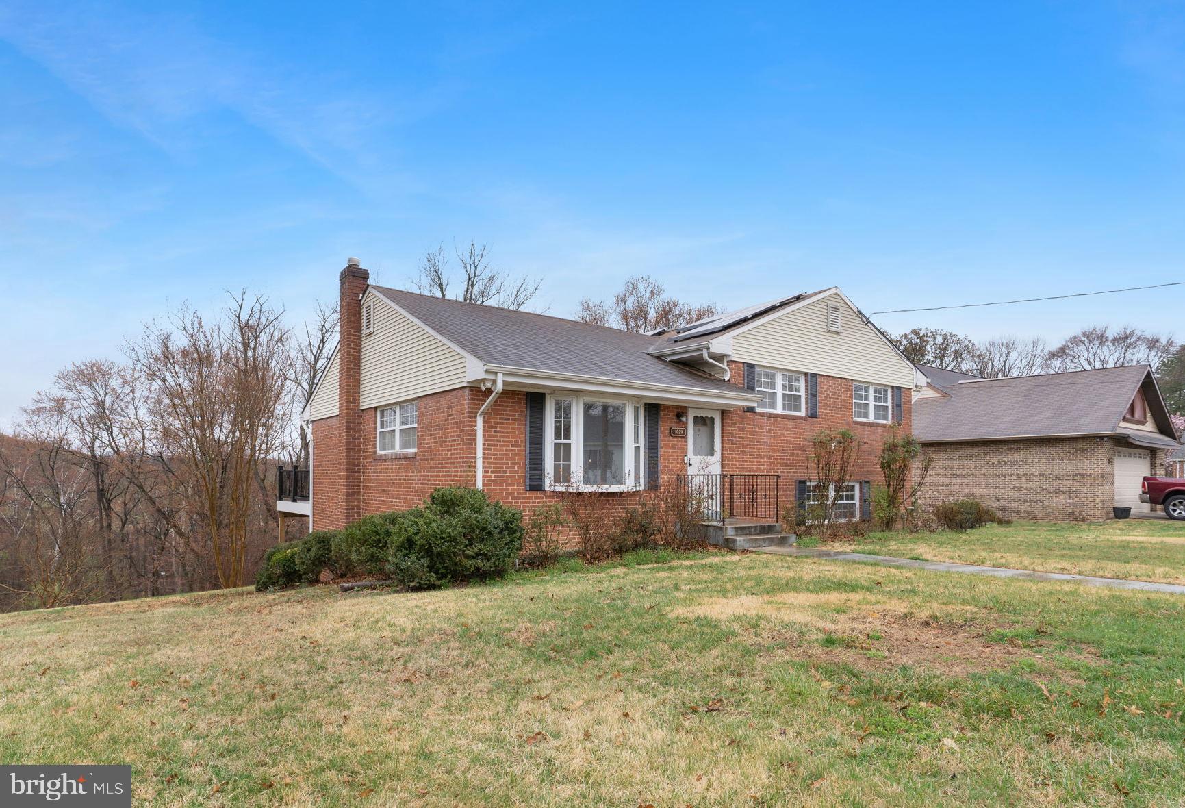 Charming all-brick home with beautiful curb appeal and flexible living space. This well-maintained property features four bedrooms and two full baths, including a finished lower-level family room with a  gas fireplace and distinctive knotty-pine wood walls that add warmth and character. The versatile fourth bedroom can easily serve as a dedicated home office, guest room, or flex space. Step outside to an inviting backyard with a large low maintenance deck—perfect for relaxing or entertaining. Ideal as a spacious single-family home or as a potential investment with dual-unit possibilities. Conveniently located near public transportation and major commuter routes, and just minutes from the National Harbor, MGM, Gaylord Convention Center, and Tanger Outlets. Schedule your tour today!