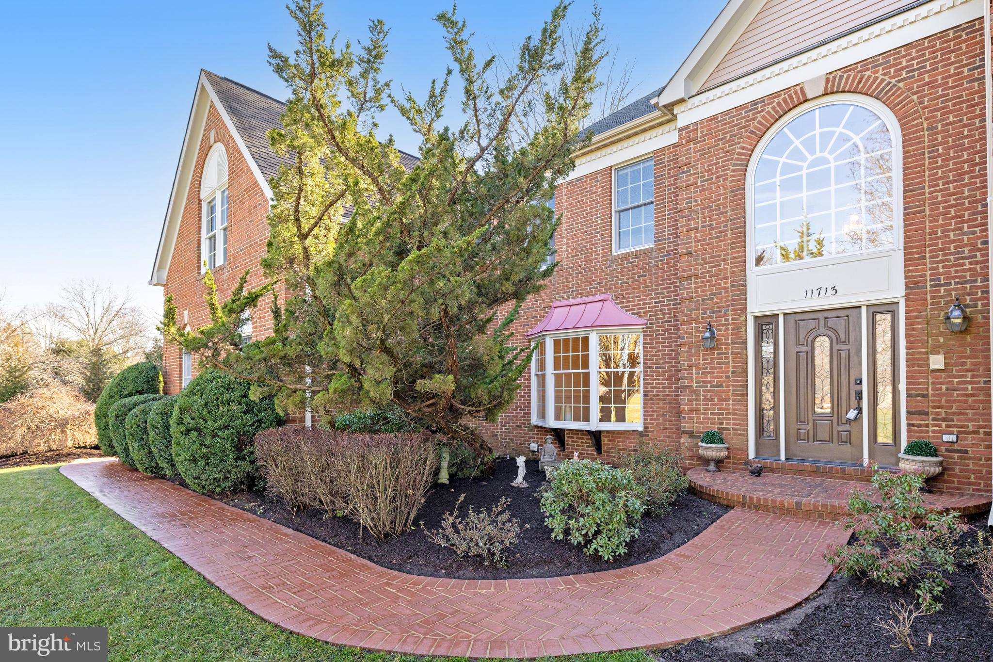 Welcome to 11713 Crippen Court in the highly sought-after Great Falls! At first you will notice the expansive feeling of this generous lot and the 3 sided brick home situated at the start of the cul de sac.
Hardwood flooring graces the main level, comprising a separate living room, a generous dining room, a main level office, and a double-ceiling family room with a captivating stone hearth fireplace. The updated kitchen, complete with a center island and a breakfast room leading to the backyard, is perfect for both daily living and entertaining.
The upper level features four bedrooms and a den (or potential fifth bedroom), including a primary updated bathroom with a separate shower stall, a jetted bathtub, and dual-sink vanities. You have two roomy closets, built in safe and a separate sitting room to enjoy some reading or TV time before bed.  In addition to the Primary Bathroom, you will find two other bathrooms accessible to all bedrooms from the hallway.

A fully finished walkup basement, with a wet bar, recreation and home theatre options, bonus/hobby room and a full bathroom plus plenty of room for storage awaits you.  A three-car side-load garage with room to park on the driveway plus the street to add to the convenience of your life style and invited guests.  To further enhance your entertaining opportunities, explore the  beautifully landscaped level backyard, an expansive stone patio equipped with a Sound System and Speakers.  This home offers spacious interiors and exterior space, it's an ideal blend of comfort and luxury. A true Gem in Great Falls!