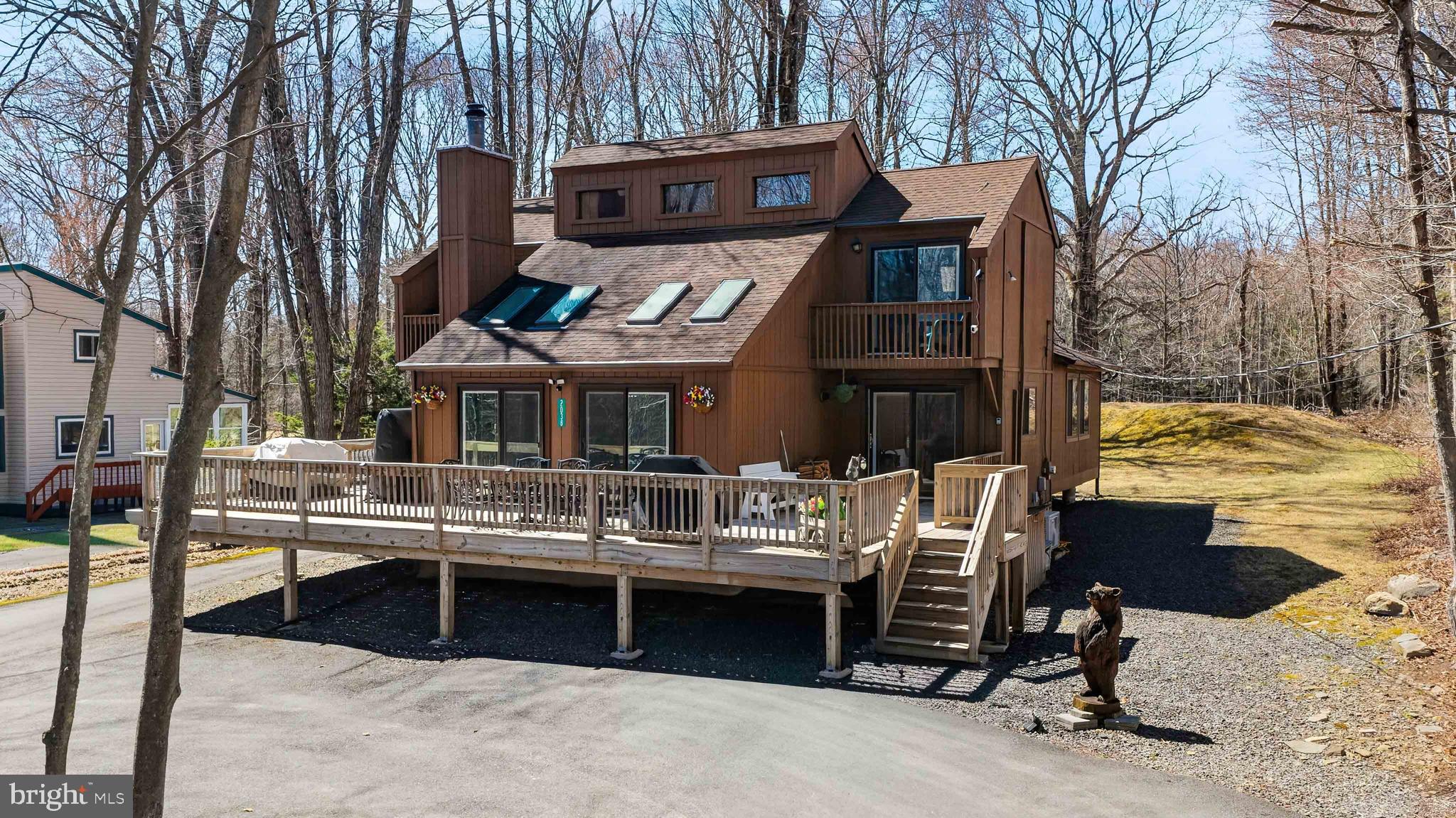 Public Remarks: Exquisite Pocono Living at Its Finest - Locust Lake Village, Pocono Lake, PA Welcome to this stunning mountain retreat fully furnished located in the highly sought-after Locust Lake Village community. This beautifully designed home blends upscale finishes with charming mountain-themed décor, creating the perfect balance of comfort and luxury. Currently boasting a 5-star rating on short-term rental platforms, this property is not only a dream home but also an exceptional turnkey investment opportunity. Featuring 3 spacious bedrooms and 2 full bathrooms, the home offers an open-concept layout with custom interior design throughout. The highlight of the property is the enormous addition, showcasing a fully equipped game room complete with billiards--perfect for entertaining guests or relaxing with family. Step outside to enjoy the large deck designed for entertaining, ideal for hosting gatherings, outdoor dining, or simply taking in the peaceful Pocono surroundings. Every detail has been thoughtfully updated, making this home truly move-in ready. Whether you're searching for a private getaway or a high-performing rental property, this home has it all. Enjoy all the amenities of Locust Lake Village, a premier Pocono community known for its lakes, recreation, and year-round appeal. Don't miss your chance to own a piece of Pocono paradise!
