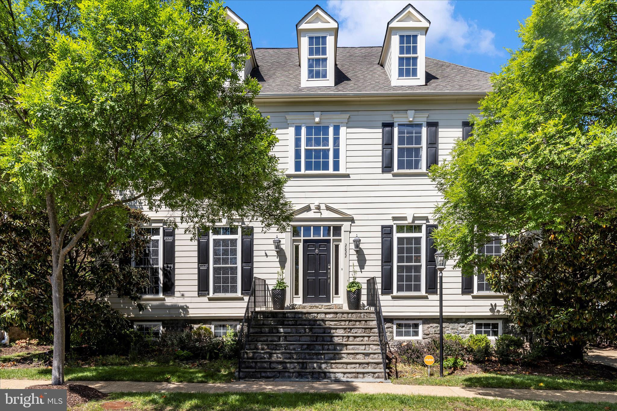 Open house Sat June 6 1-4pm  In the heart of Oakton, in walking distance to shops and grocery stores, this  extraordinary home elevated through an impressive collection of upgrades that set it apart within the neighborhood,  6 bedrooms 4.5 baths, PRIVATE DRIVEWAYS with space for 5 vehicles,  hardwood floors,  2-story foyer,   beautiful living room with plastered walls, a custom-crafted library door, and ,  formal dining room and separate breakfast area.   The kitchen with island with brown marble countertops, travertine floors, a wet bar, and premium GE Monogram appliances. The adjoining family room carries that same design ambition, with an interlaid travertine and hardwood floor, coffered ceiling, and custom built-ins.   A Waterworks powder room,  the curved staircase framed by a dramatic custom tile wall, tray ceilings and decorative columns in living and dinning room.  Upper level the owner's suite is anchored by a 3-sided gas fireplace and appointed with a breakfast and wine bar with refrigerator,  his and her custom closet systems, a makeup counter, and a primary bath featuring a soaking tub, separate shower and double vanities. Three additional bedrooms each offer their own distinct character, with upgraded bathrooms throughout — one ensuite, two sharing a Jack-and-Jill. The bedroom-level laundry room with counter space, cabinet, and built-in sink.   The lower level is where this home truly distinguishes itself. A safari-themed playroom with hand-painted professional murals and  walk-in closet, it can be a bedroom;  the mirror-walled room can be a bedroom,  home gym, yoga studio, Pilates space, dance studio, or meditation retreat.   The great recreation room is a home theater setting, with the built-in bar: dishwasher, beverage refrigerator, kegerator, commercial ice machine, and sink, all positioned facing a large-screen home theater and bar TV powered by a super high-end rack audio system that fully conveys. Three gas fireplaces found throughout the home add warmth and ambiance on every level.  An upgraded full bath bathroom serves the guests on this level.   Step outside, a wisteria-draped pergola and WiFi-enabled outdoor speakers extend the entertaining seamlessly into the private backyard.  Even the garage earns its own introduction: checkerboard flooring, built-in cabinetry, powered storage lifts,  a dedicated refrigerator and it is Tesla-ready.    Recessed lightnings, crown moldings, decorated columns, ceiling fans,  surrounding sound system, the list  is long.   All  TVs,  5 fridges, customized draperies,  home theater and surrounding sound system equipment, bespoke window treatments all convey.    Walk to public library and grocery store, Oakton Shopping Center and Hunter Mill Plaza are both just minutes away on foot, while Route 66, Route 50, the Dulles Toll Road, Tysons Corner, Vienna Metro, Reston Town Center, and top-rated Fairfax County public schools are all within easy reach by car.    Luxury at this level, in a location this convenient, simply does not come available often.