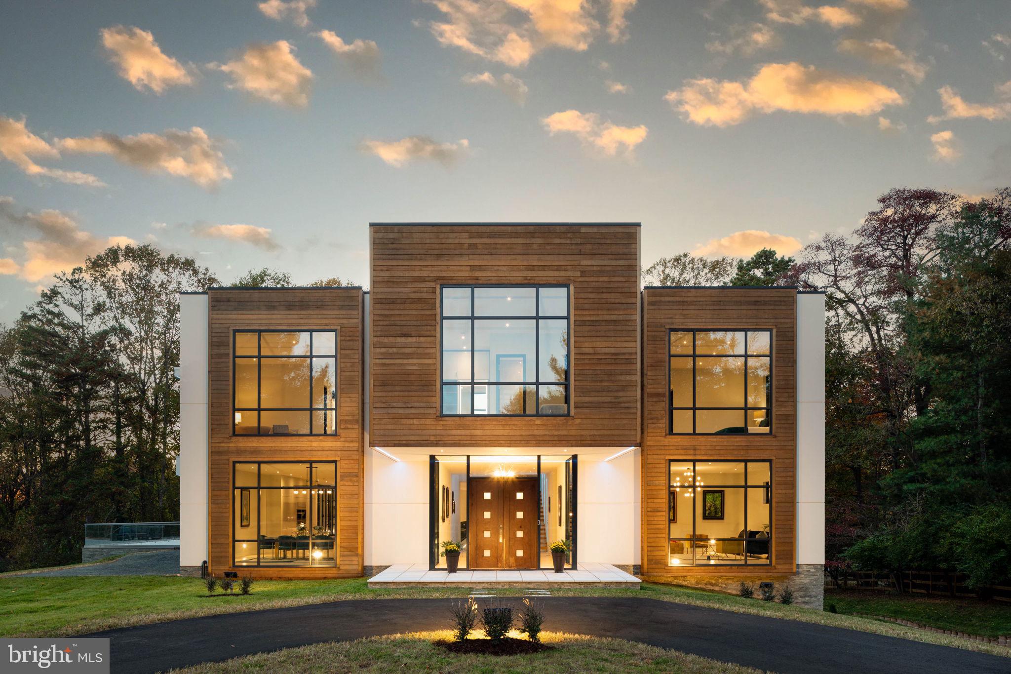 Nestled in the beautiful Hidden Estates Community you'll find this absolutely magnificent, one-of-a-kind, newly constructed European Contemporary featuring over 15,000 interior square feet and over 6,000 square feet of exterior entertaining space. Designed with symmetry in mind, the exterior architecture of this home includes an elegant balance of stucco, stone and cedar. Majestic two-story floor to ceiling windows and skylights let in an abundance of natural light with extensive outdoor spaces that can be accessed via custom accordion doors for indoor/outdoor enjoyment. Upon entry, the impressive foyer opens up to the central floating staircases. The foyer leads to a stunning open concept gourmet kitchen featuring Hacker cabinets, integrated Miele appliances, Grohe fixtures, and Silestone countertops. A formal dining room, family room, and sitting room with accordion doors open up to two different outdoor areas for 180-degree indoor/outdoor entertaining. Main floor also includes a formal living room, office and half bath. This contemporary floor plan includes 10-foot ceilings throughout, soft Ivory Italian Iris tile on the main and lower levels with engineered 9-inch-wide plank White Oak hardwoods on upper level for an all-around polished and modern atmosphere. The upper level includes a decorative skylight feature with colorful LED surround providing an open and airy space that separates the six bedroom suites. All bedrooms feature custom walk-in closets complete with organizers, ensuite bathrooms with Duravit vanities and commodes, frameless glass showers with elegant Grohe fixtures, backlit mirrors, and Italian Iris tile. Upper level also includes a dedicated laundry room with built in cabinets, sink and raised front loading washer and dryer. An entertainer's dream, the lower level is decked out with a 1000+ bottle wine cellar, wet bar, fitness room, music room, dedicated art room and movie theater with Nappa leather seating. Car enthusiasts look no further; this 7-8 car garage has gorgeous cedar doors, epoxy flooring, a colorful LED lit car showroom as well as a large utility room with space for storage. Additional features include Savant Audio Visual system, security system, TPL roof, color coordinated LED indoor/outdoor built-in lighting, and geothermal heating and cooling systems. For your furry friends, a dedicated dog wash room with elevated bath. There are also four opulent cantilevered balconies, a circular driveway for ample parking, and 2.24 acres with space for luxury pool or sport court. This is a unique gem that you won't find anywhere else in the area!!