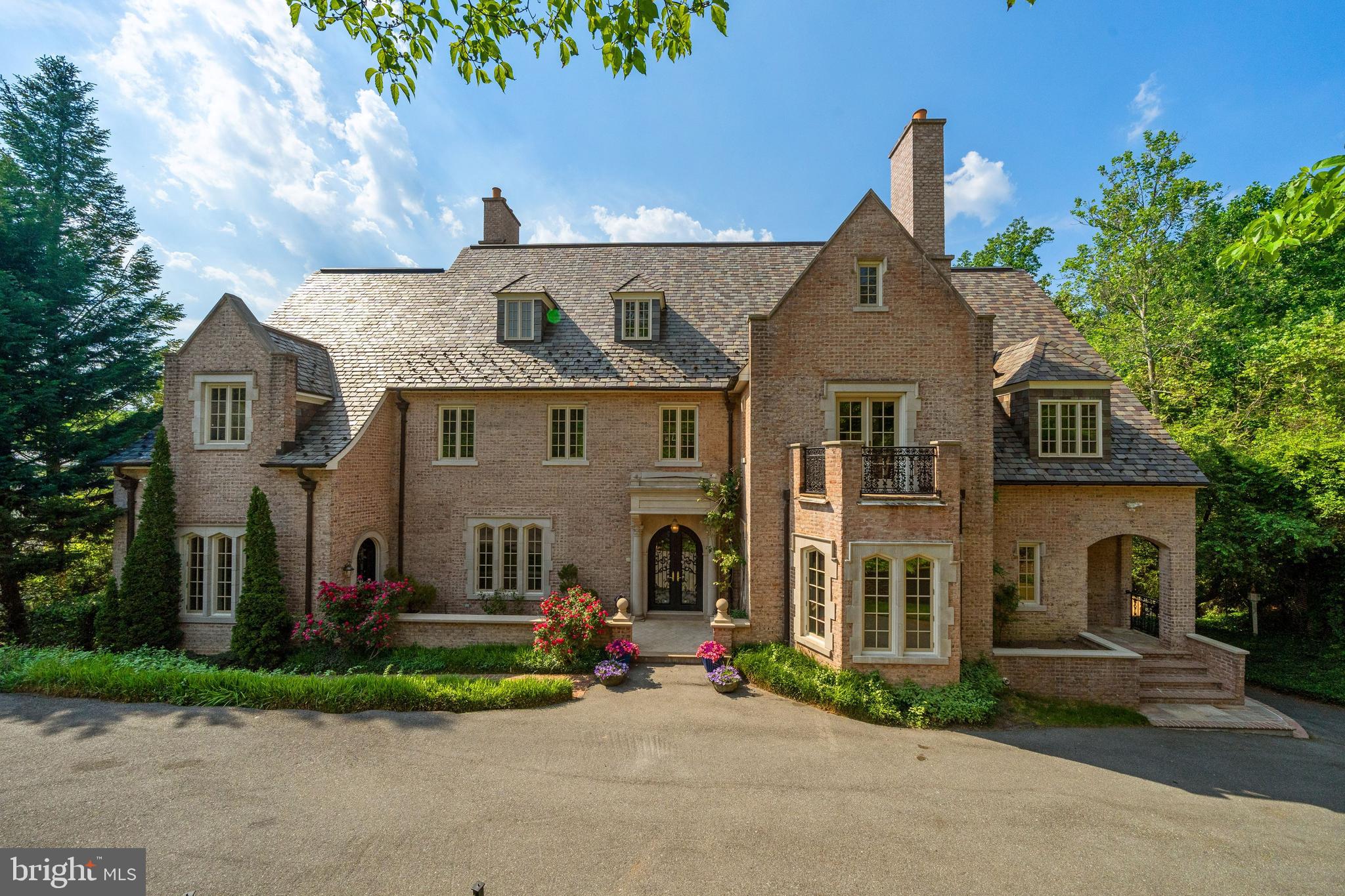 Stunning estate in the heart of Wesley Heights with over half an acre. Boasting seven suites with private bathrooms, four levels with 10+ foot ceiling height, and all levels with expansive backyard views. Home is nestled below street level, providing full sunlight to the main and upper levels, and total privacy on the main level. The primary bedroom includes two primary bathrooms with heated floors, each with a walk-in closet and separate lounge. Four of the upper suites includes balconies overlooking the backyard. Six total balconies on the upper two levels. Suite-level den also includes gas fireplace and balcony. The main level boasts an eat-in kitchen with heated floors and direct walk-out to terrace, a separate dining room with fireplace, and open family and living rooms can be separated by pocket doors. Spacious foyer is light filled and ornately decorated with wrought iron – providing access to the lower level and most of the main level, including the 2-room office or pool room with private entrance, powder room, and direct access to the meeting room and wine room on the lower level. Lower level includes two suites, wine room, a private staircase for the two-level office and conference room, and great room. The great room has three French doors opening to a covered patio, which continues to the terraced backyard. -          Wrought iron doors and staircase banister designed and created by Patrick Cardine of the Washington National Cathedral -          Clive Christian cabinets in kitchen -          Separate Sub-Zero refrigerator and freezer in kitchen -          WOLF kitchen cooking appliances -          Sheryl Wagner fixtures in both primary bathrooms -          Primary Bath 1: Black Onyx and Gold, steam shower -          Primary Bath 2: Pink Quarts and Gold -          Double sided fireplace between office and living room -          5 zone HVAC -          3.5-car garage + storage -          5 fireplaces: 4 wood and gas combination, 1 gas only -          Wine room with attached tasting room/meeting room -          Heated floors in: Kitchen, both Primary Bathrooms, foyer -          3 60+ hot-water tanks