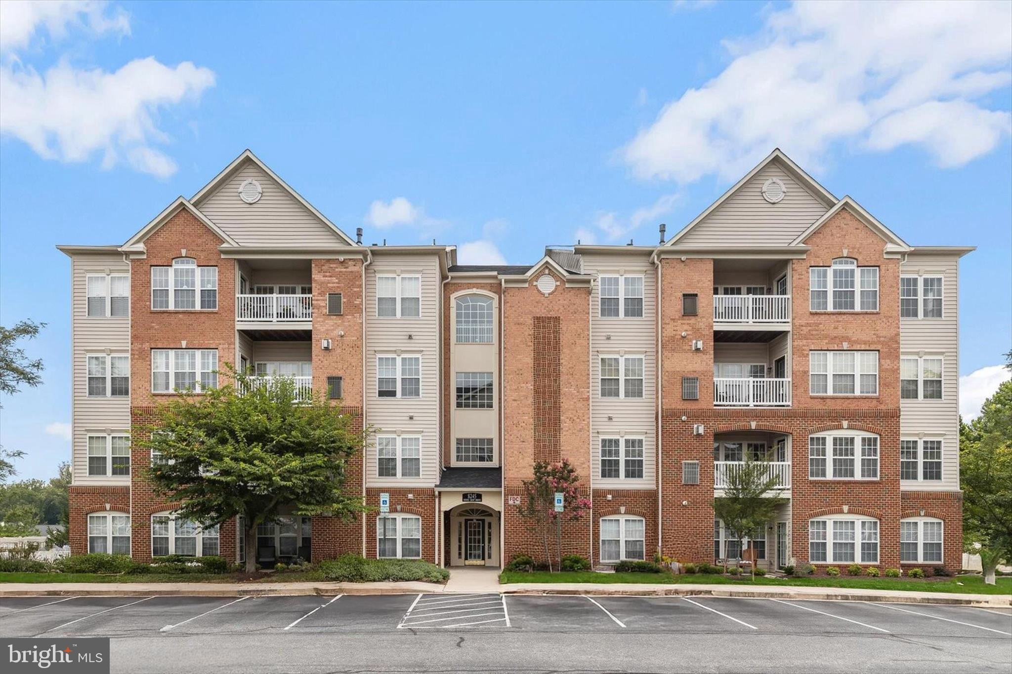 Welcome to 8245 Stone Crop Drive, Unit E, a beautifully maintained residence in the highly sought-after 55+ community of Hearthstone at Village Crest in Ellicott City. Designed for comfortable, low-maintenance living, this exceptional home offers abundant natural light, elegant finishes, brand new plush wall to wall carpeting, and a spacious open floor plan that creates an inviting atmosphere throughout.
The welcoming living and dining rooms are enhanced by classic moldings and provide the perfect setting for both everyday living and entertaining. The well-appointed eat-in kitchen features hardwood flooring, ample cabinetry, decorative tile backsplash, a pantry, and a sunny breakfast room complete with custom built-in cabinetry and direct access to the private balcony, creating the perfect spot to enjoy your morning coffee or unwind at the end of the day.
The spacious primary suite serves as a peaceful retreat, offering a comfortable sitting area, walk-in closet, and a spa-inspired en-suite bath with dual vanities, a glass-enclosed shower, and a linen closet. A generously sized second bedroom, full hall bath, convenient laundry area, and abundant storage space complete the interior.
Residents of Hearthstone at Village Crest enjoy plentiful parking and access to an impressive array of resort-style amenities, including a clubhouse, outdoor pool, tennis courts, fitness center, walking paths, and gathering spaces that foster an active and vibrant lifestyle. Ideally located just minutes from Historic Ellicott City, Long Gate Shopping Center, restaurants, grocery stores, and everyday conveniences, the community also offers easy access to US-29, MD-103, I-70, and Route 100 for effortless commuting throughout Central Maryland. Combining comfort, convenience, and exceptional community amenities, this wonderful home offers the very best of active adult living.