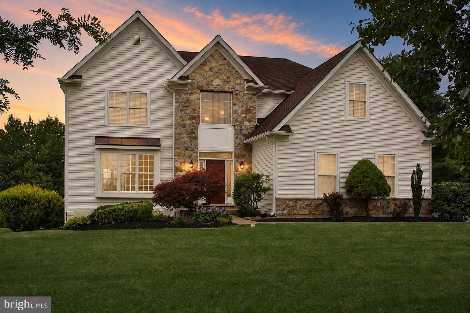 Welcome home to this beautifully updated and meticulously maintained 3,400+ square foot residence, perfectly situated on a picturesque half-acre lot overlooking peaceful wooded open space. Offering 4-5 bedrooms, 3½ baths, and three finished levels of thoughtfully designed living space, this home is ideal for both everyday living and entertaining.
Step inside the impressive two-story foyer, where you're welcomed into bright, open living spaces featuring new carpeting and updated flooring. The spacious living room flows seamlessly into the heart of the home—a stunning island kitchen complete with granite countertops, abundant cabinetry, and a sliding glass door leading to the expansive rear deck with retractable awning. Whether you're enjoying your morning coffee or unwinding after a long day, the private wooded backdrop creates the perfect setting.
Conveniently located on the main level, the laundry room offers direct access to the outside, making everyday tasks like gardening, yard work, or bringing in pets simple and convenient.
Up the turned staircase, the spacious primary suite offers a peaceful retreat with a separate sitting room or home office, a generous walk-in closet, and an ensuite bath featuring a soaking tub, separate shower, and double vanity. Three additional generously sized bedrooms and a full hall bath complete the second floor.
The finished walk-out lower level provides endless possibilities with an expansive recreation and gathering area, complete with a wet bar, mini refrigerator, and cozy gas stove for those cooler evenings. Sliding glass doors fill the space with natural light and provide easy access to the backyard. This level also features a fifth bedroom or flexible space for a home office, gym, or den, along with a full bath.  Makes for a great guest suite or space for returning college students or Au Pair.  Separate storage area neatly houses the home's utilities.  
Conveniently located just minutes from the Pennsylvania Turnpike, shopping, parks, walking and biking trails, and some of the area's favorite dining destinations, including Butcher & Barkeep, Bella Fiona, Bay Pony, The Vault, and many more. Quaint Skippack Village, with its charming boutiques, restaurants, and seasonal events, is only a five-minute drive away.
Lovingly cared for by its original owners including windows and sliders replaced on back of home.  Stucco remediated and replaced with siding in 2026.  This exceptional home is ready for its next chapter.  A one-year home warranty is included for added peace of mind.
