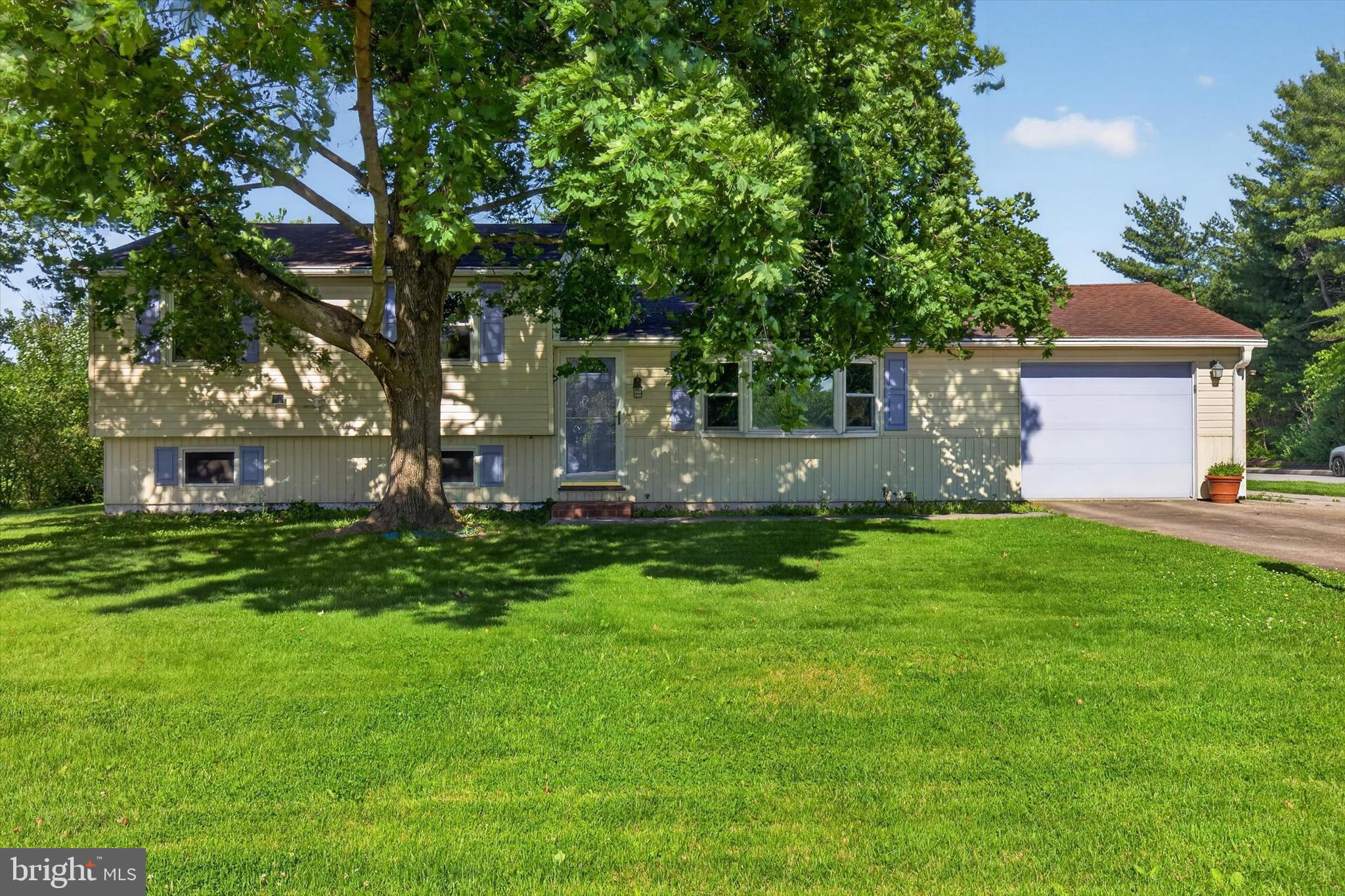 If garage space and a great location are at the top of your wish list, you'll want to take a look at this split-level home just outside of Jonestown. Featuring a 24'x44' heated detached garage and a flat .46-acre lot, this property is located in Swatara Township within the Northern Lebanon School District and close to Swatara Creek. It is the perfect find if you've been looking for an impressive garage setup, plenty of yard space, and a solid location. Conveniently located with easy access to Route 72, Route 22, and I-81, it offers a great commute to Fort Indiantown Gap, Lebanon, Harrisburg and surrounding areas. The main floor features a living room with a wood-burning fireplace, a kitchen equipped with granite countertops, a brand-new Samsung gas stove with a built-in air fryer, and a dining area. The upper level has 3 bedrooms with new flooring installed in 2024, and 1.5 baths. Downstairs, the finished lower level features a recreation room that serves as a great extra living space or flex room, along with a water filtration system and dedicated utility and storage rooms. The standout feature of this property is the detached, heated garage, which is cleverly split in two. The front half is wide open for parking, working on cars, or parking the boat, while the massive back half is a dedicated workshop and storage area that could easily make an awesome party spot or hangout room. Attached to the house is an additional 1-car garage for everyday parking. Out back in the yard, there is also a separate storage shed tucked away, giving you the perfect spot to throw the kayaks after a day out on the creek. The seller has taken care of several major mechanical items, including a newly installed whole-house Generac generator (2024) and an updated stand-up shower (2023). The house is being sold As-Is. It is a practical layout that just needs cosmetic updates, so bring your paint brush and your own ideas to finish it your way and build instant equity. Schedule your showing today!