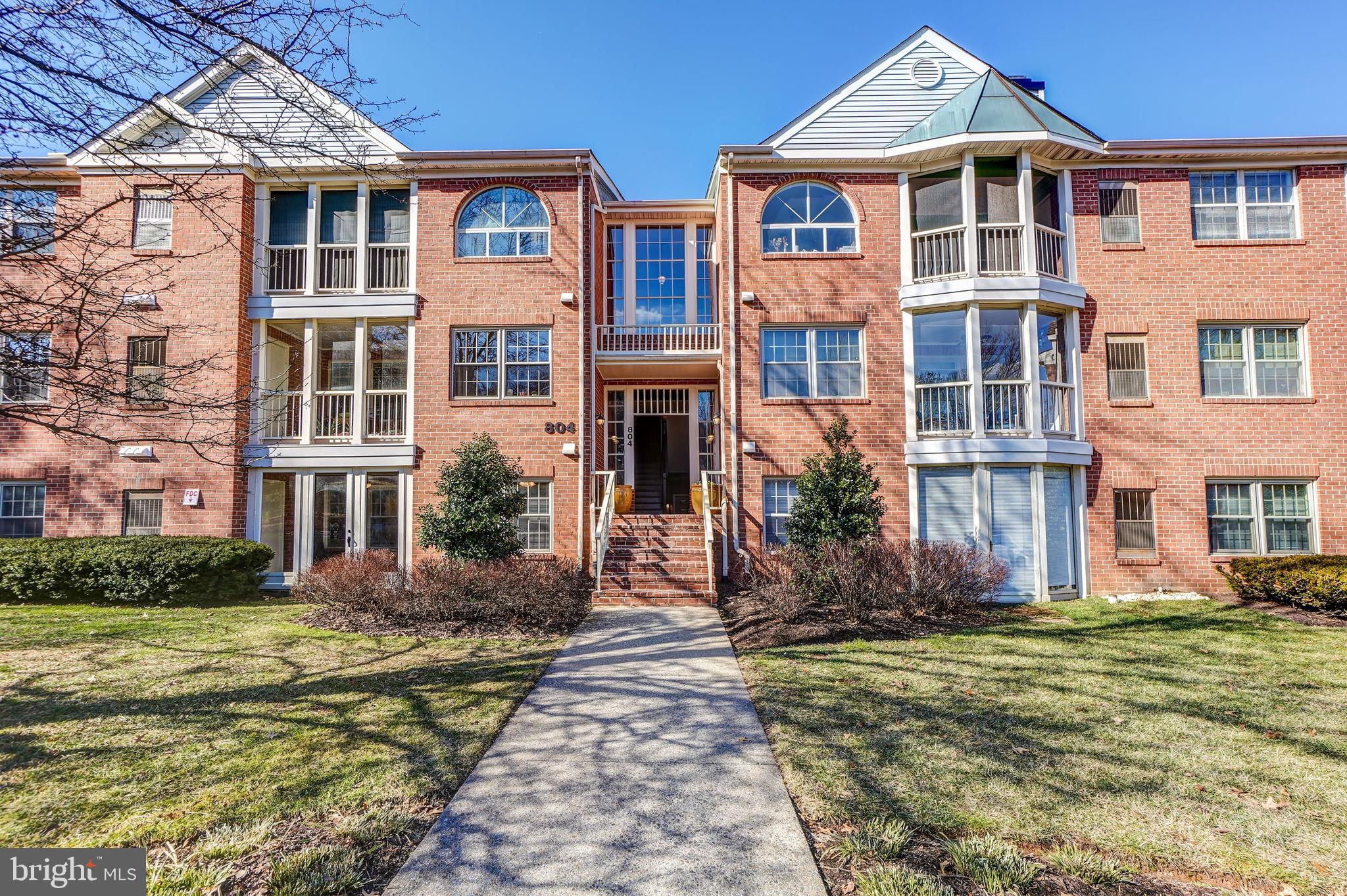 Bright, open, and move-in ready! This ground floor unit is in the desirable Washingtonian Woods community. This property features over 1,100 square feet of living space with 2 primary bedrooms and 2.5 bathrooms.  The living room is bright and spacious with a cozy fireplace. The dedicated dining room is large with access to your sunroom. The sunroom is enclosed for year-round enjoyment with access to the exterior via private entrance to the common grounds. A pathway to the private entrance was previously approved by the association. The bedroom suites each have attached ensuite baths and double closets. Community amenities include abundant parking, pool, playground, tennis courts, a bike trail. Just minutes to I-270, ICC, and public transit. Close to Rio and Downtown Crown centers with ample shopping, dining, and entertainment venues. Don't miss out on this gem!