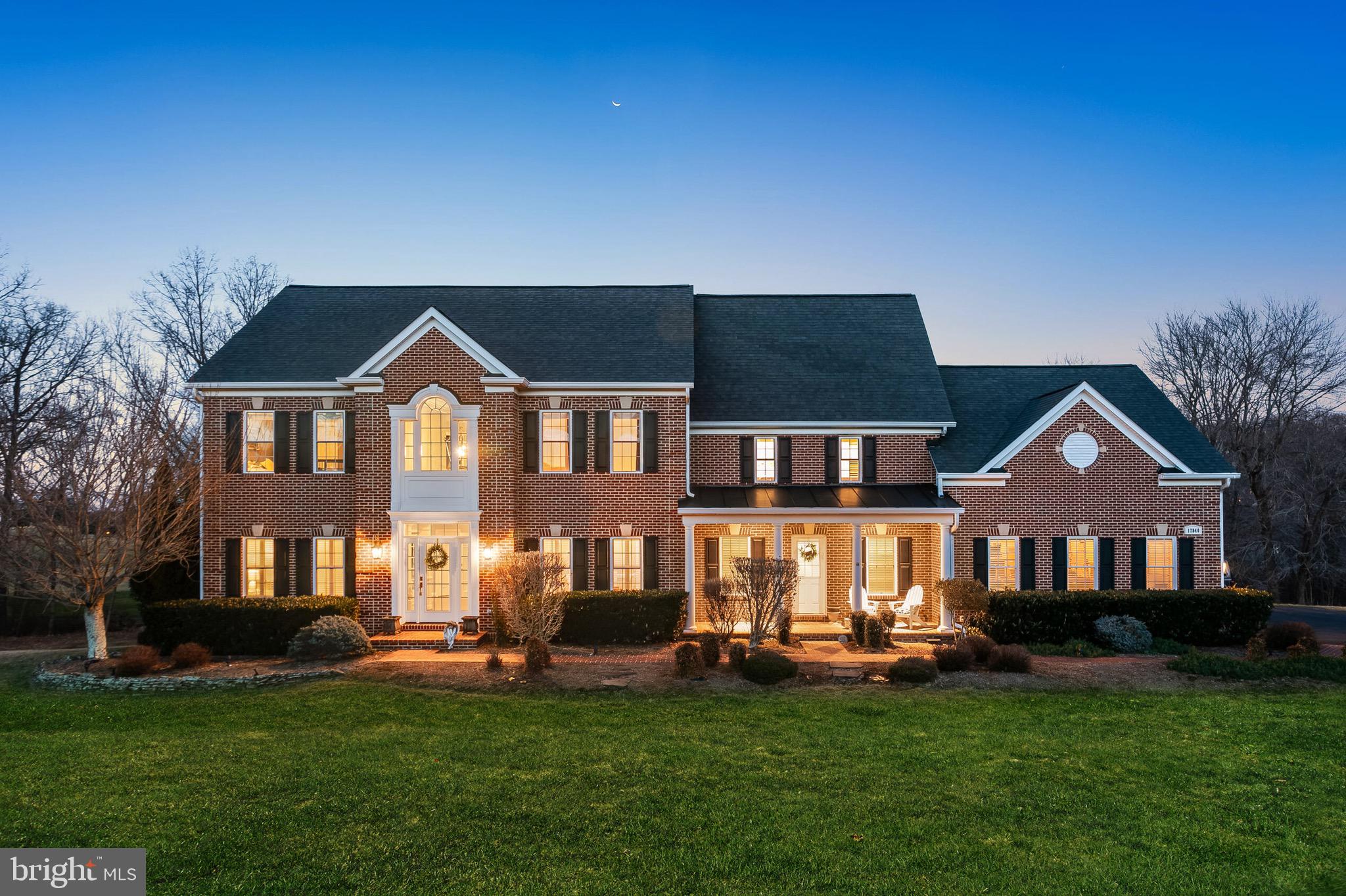 NO OPEN HOUSE ON SUNDAY 2/16  -it is Cancelled. Welcome to Resort-style Living at Stoneleigh Country Club! This exceptional custom colonial home is nestled on over 2 acres of pristine land with sweeping golf course views - directly backing to the 10th green. With a timeless red brick and HardiePlank exterior, this residence boasts 2 front entrances, a side-load 3-car garage, and a stunning rear deck that spans the length of the home, providing the perfect space for outdoor relaxation and entertaining.

Inside, this meticulously maintained home spans over 7,000 square feet of living space, thoughtfully designed to blend elegance with everyday comfort. The current owners have invested over $350,000 in recent upgrades, ensuring that this home is in impeccable condition. The main level features beautiful oak hardwood floors, a formal living and dining room, an expansive office with a wall of windows and French doors, a versatile bonus den/flex space, and a two-story great room, perfect for family gatherings.

A butler's pantry, mudroom with tile floors, laundry, and a gourmet kitchen with a spacious, breathtaking breakfast area offers serene pond views. French doors lead to the deck from both the office and breakfast room, seamlessly connecting indoor and outdoor spaces.

The primary bedroom is a luxurious retreat, highlighted by a remodeled en-suite bath with a soaking tub, frameless shower, dual sinks, and a fireplace insert. The bedroom itself features a tray ceiling and a private sitting room that can easily serve as a home office. A jaw-dropping 16x20 walk-in closet with custom built-ins completes the suite. Three additional bedrooms and two beautifully remodeled bathrooms complete the upper level, offering ample space and comfort.

The walk-out finished lower level expands your living space by 2,200 square feet, featuring:
- A second kitchen
- A second laundry
- A 5th bedroom
- A full bathroom
- A versatile flex room currently used as a 6th bedroom
- A large living room
- A private gym with barn doors
This layout is ideal for multi-generational living.

Step outside to the expansive Trex deck, where breathtaking views of the golf course set the perfect backdrop for outdoor gatherings. The tranquil backyard offers the ultimate retreat, inviting you to relax and unwind in nature's beauty.

This home is on public utilities—no need to worry about wells or septic systems. Walk or take the golf cart to Stoneleigh Country Club. Offering different tiers of membership, members enjoy exclusive access to the:
- Championship golf course
- Tennis and pickleball courts
- Swimming pool
- Tavern
- Clubhouse
- Event barn

Don't miss your opportunity to own this exquisite estate in one of Loudoun County's most coveted communities. Welcome home to Stoneleigh Country Club—where luxury and leisure are always at your doorstep!